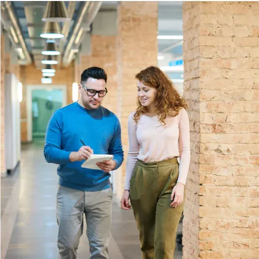 Business consultation - professionals discussing with tablet