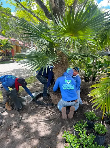 Integrity Landscape crew members in branded uniforms on the job in Jupiter, FL