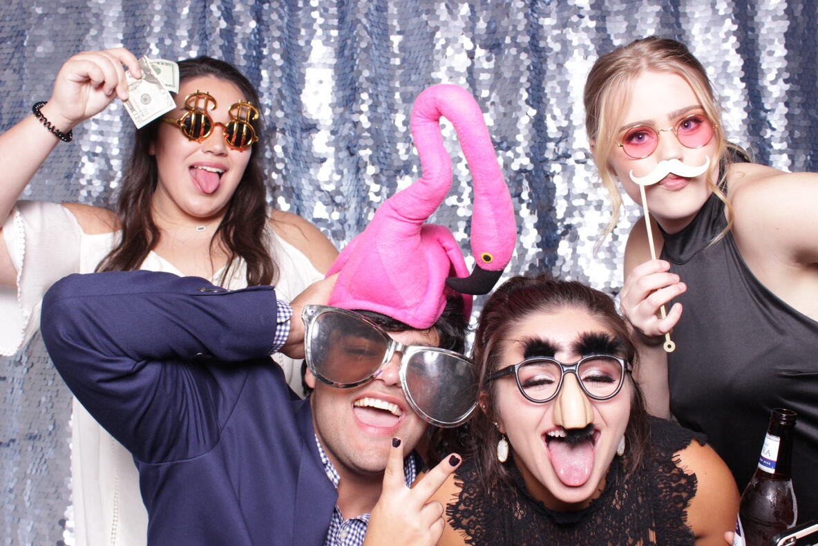 Group of friends at gold sequin backdrop