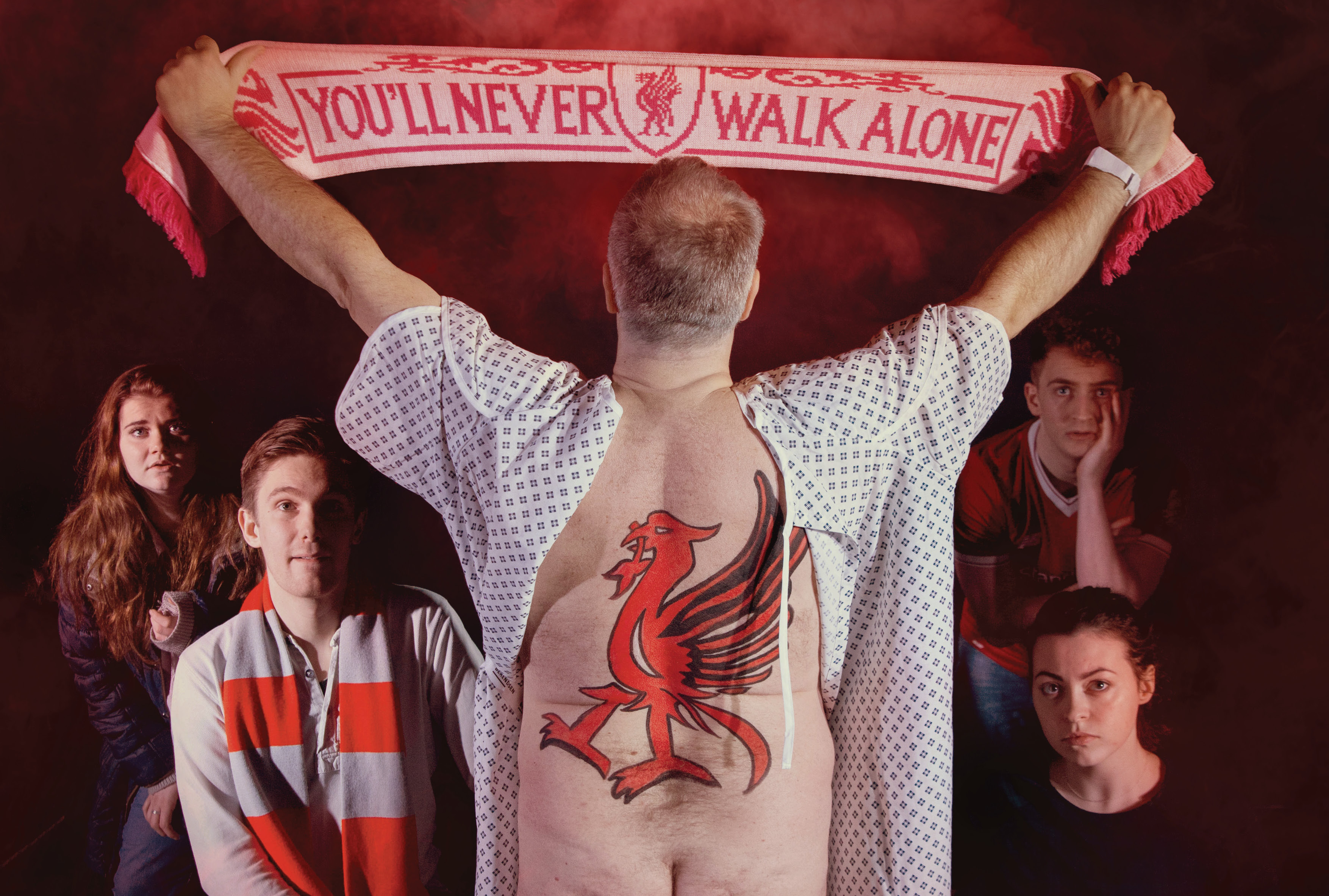 A dramatic moment from Istanbul showing a supporter holding up a Liverpool scarf