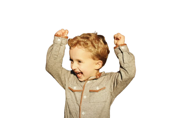 Excited boy celebrating with arms raised