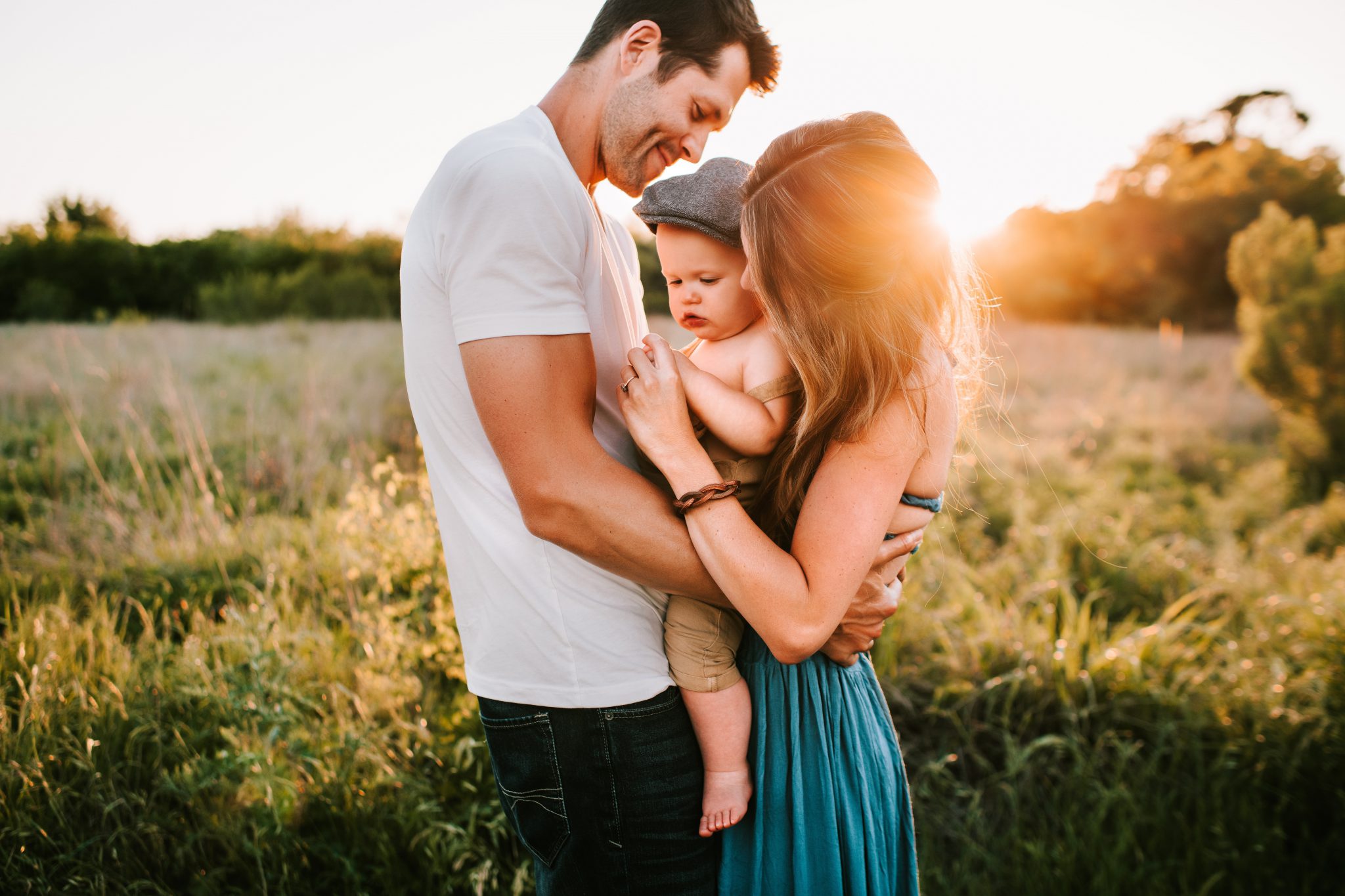 Family embracing at sunset