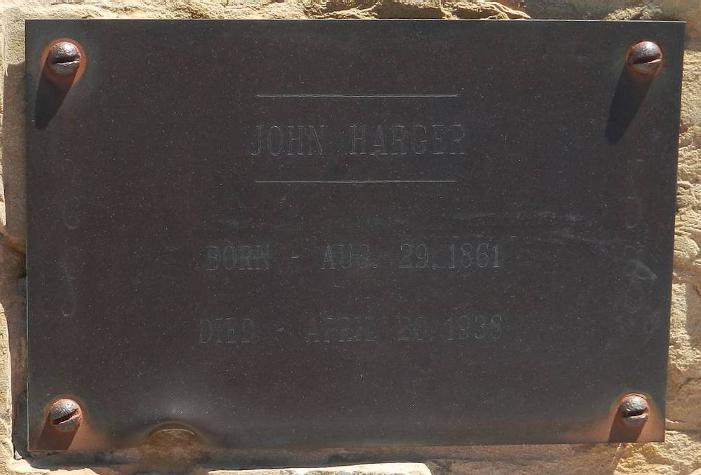 John Harger's memorial plaque set into a desert stone