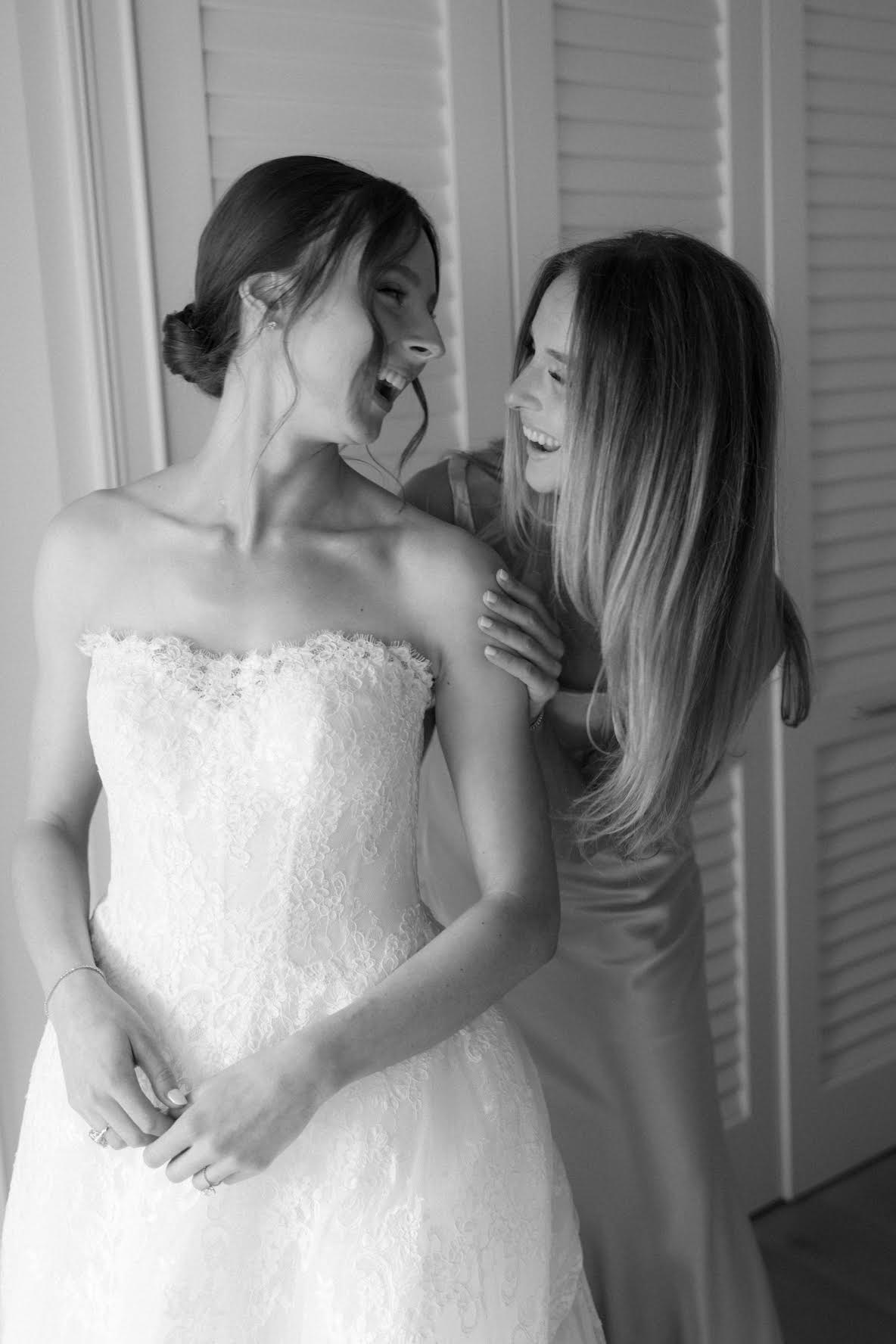 Kelly with a bride, laughing