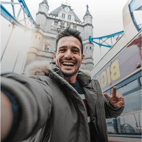 Man taking selfie at Tower Bridge London