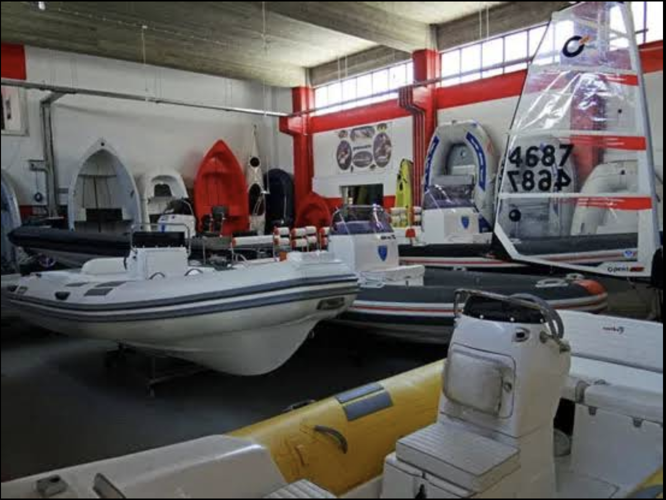 Showroom interior with boats and equipment