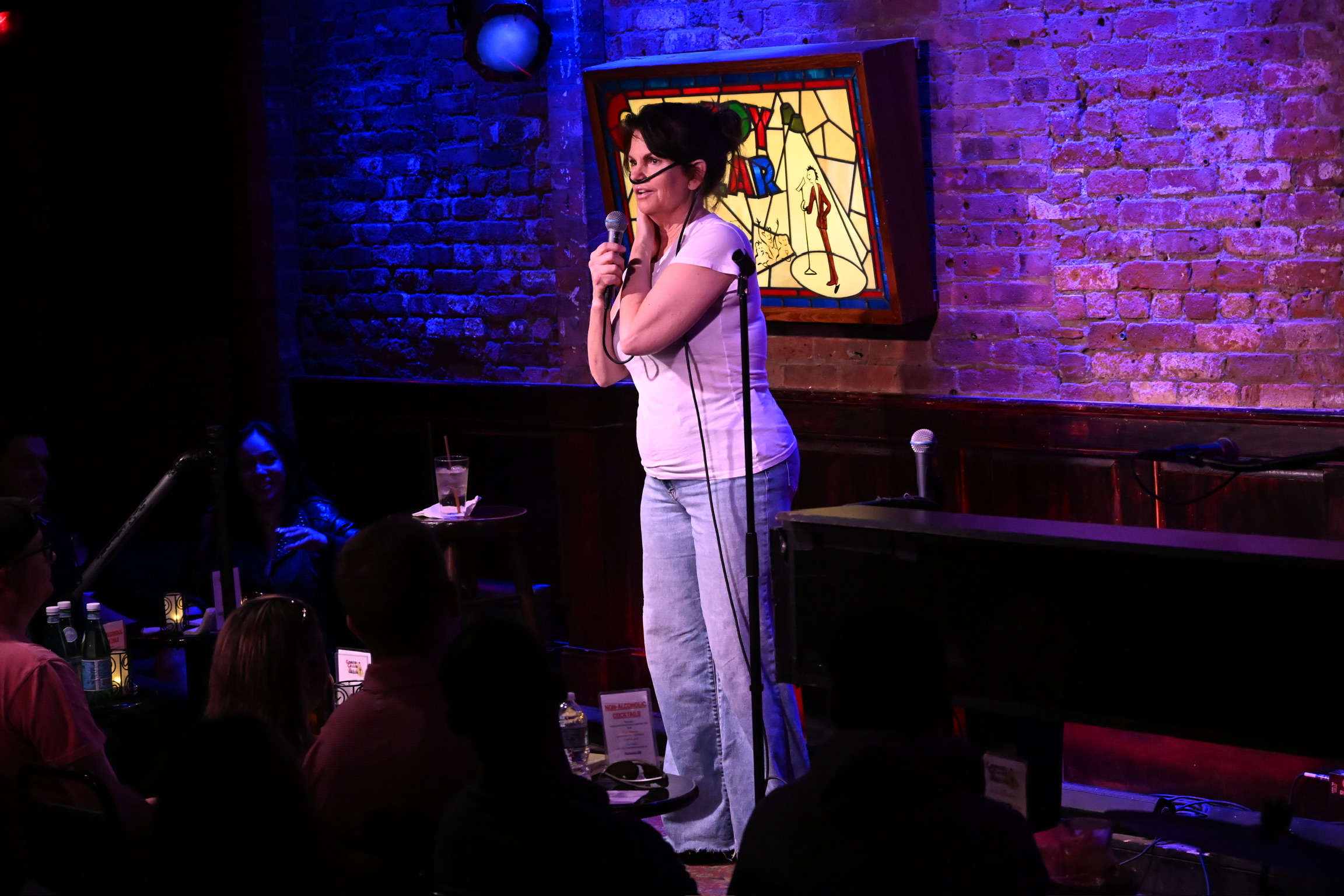 Lynne Koplitz performing on stage at the Comedy Cellar
