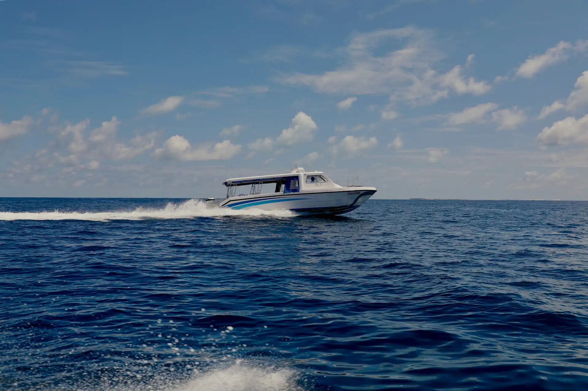 Maldives speedboat crossing open water from Velana International Airport