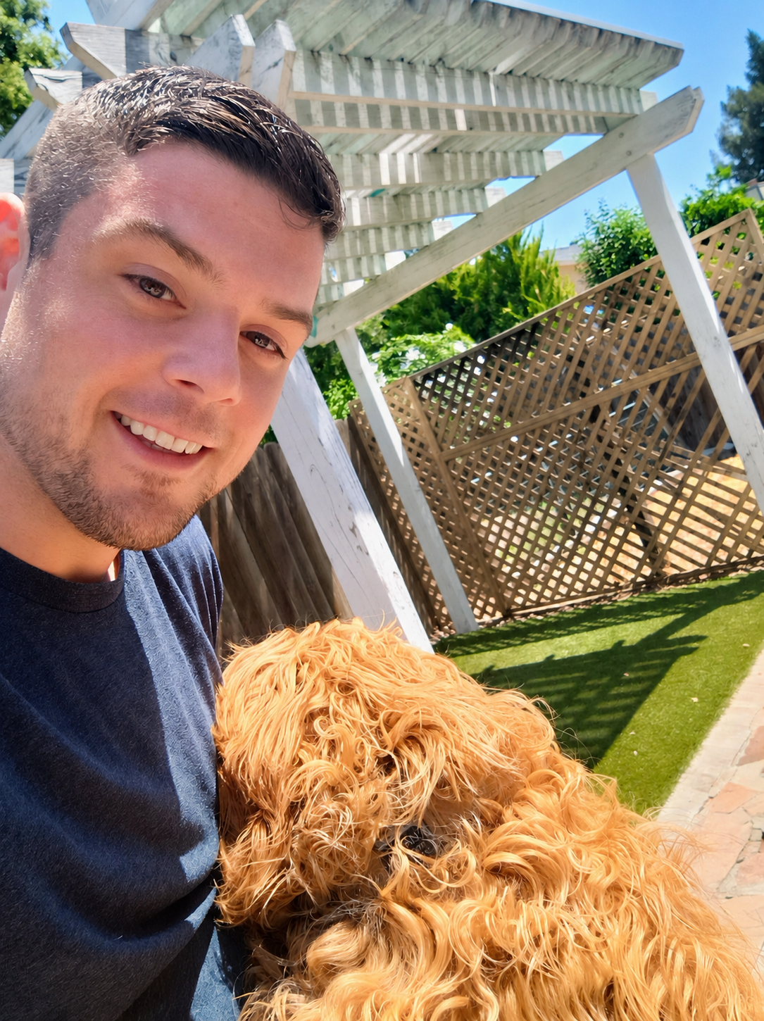 Doo It Right founder Adam with his golden doodle
