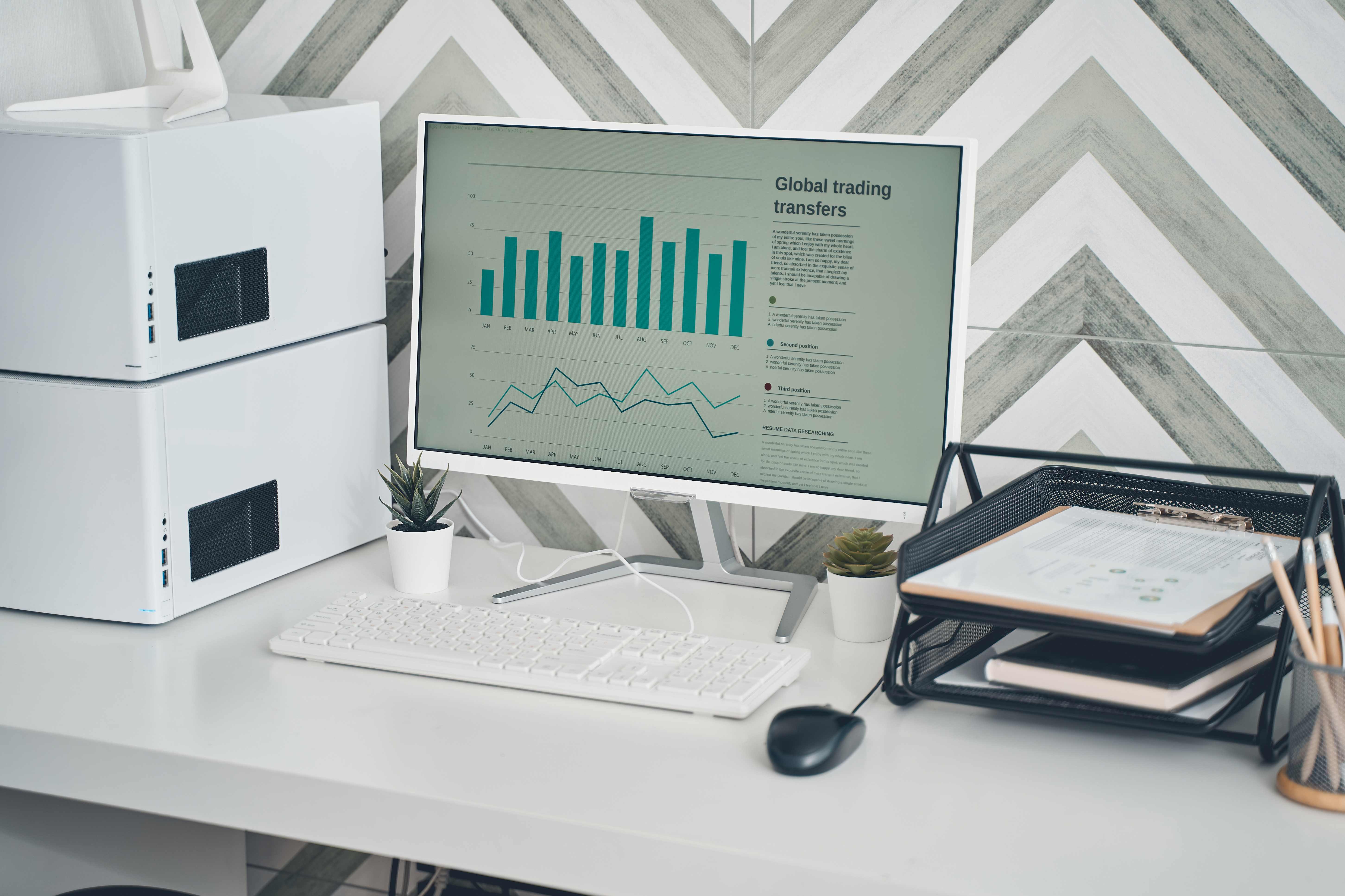 Workspace with multiple monitors displaying charts and dashboards representing legal analysis capacity