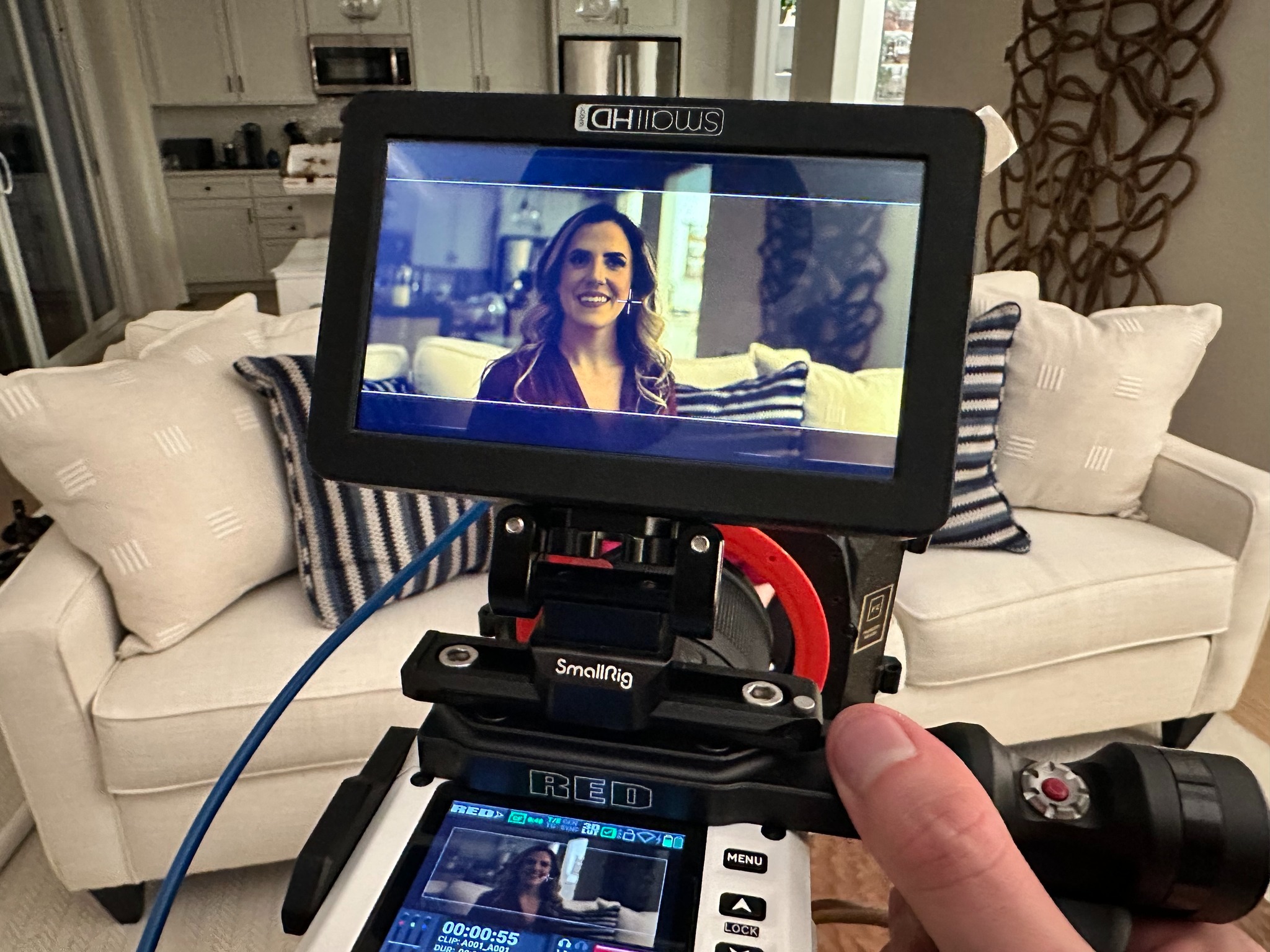 RED camera monitor showing actress on set