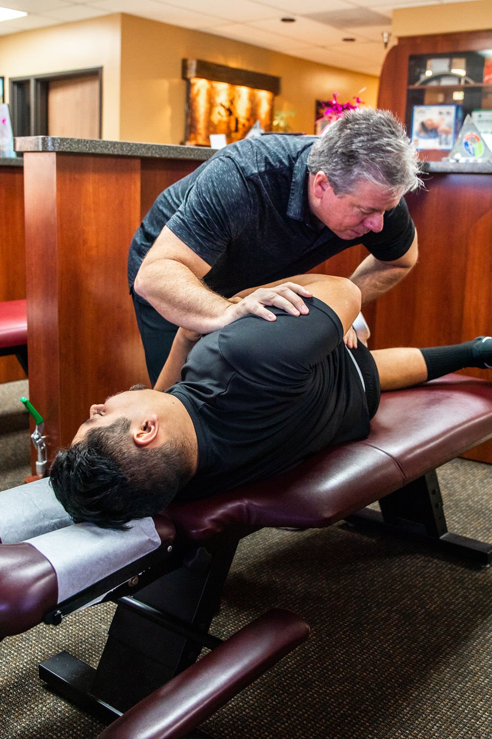 Dr. Gary B. Wright providing specialized chiropractic care to patient