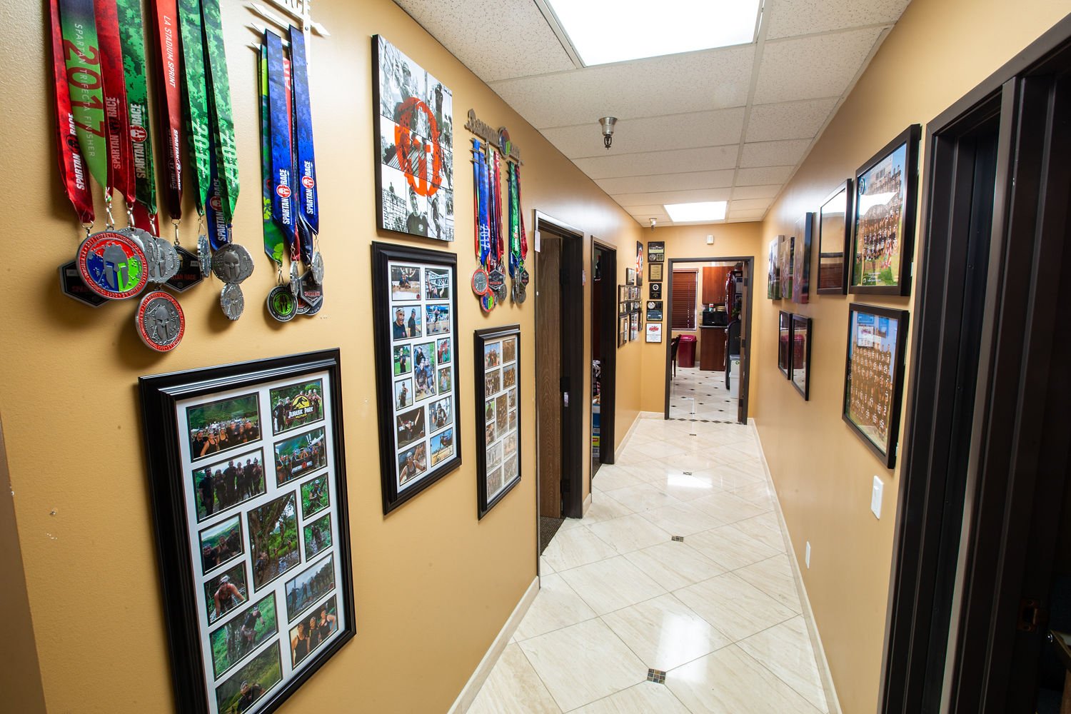 Office hallway with awards and photos