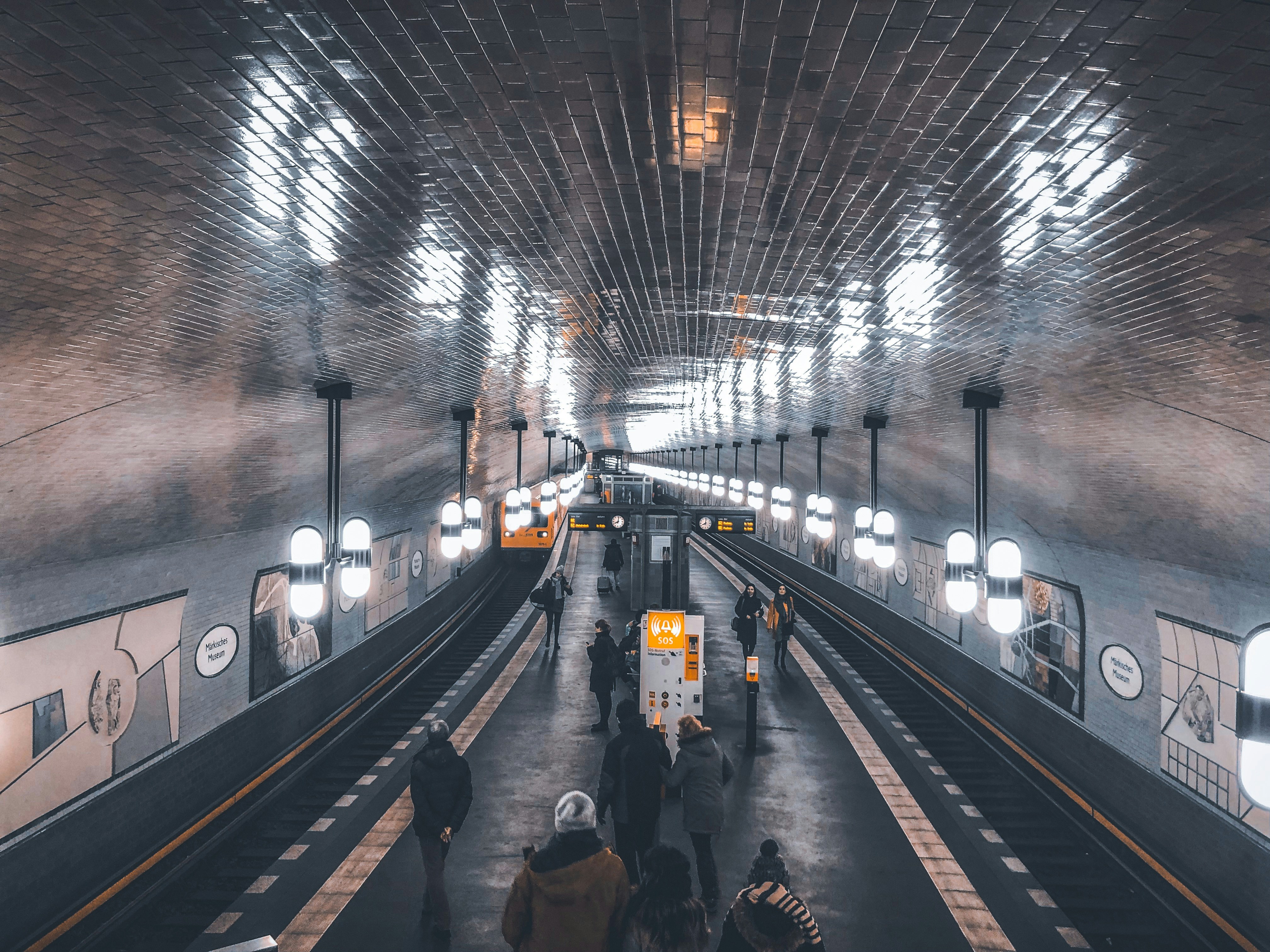 Berlin U-Bahn Märkisches Museum station with curved tiled ceiling and passengers on platform