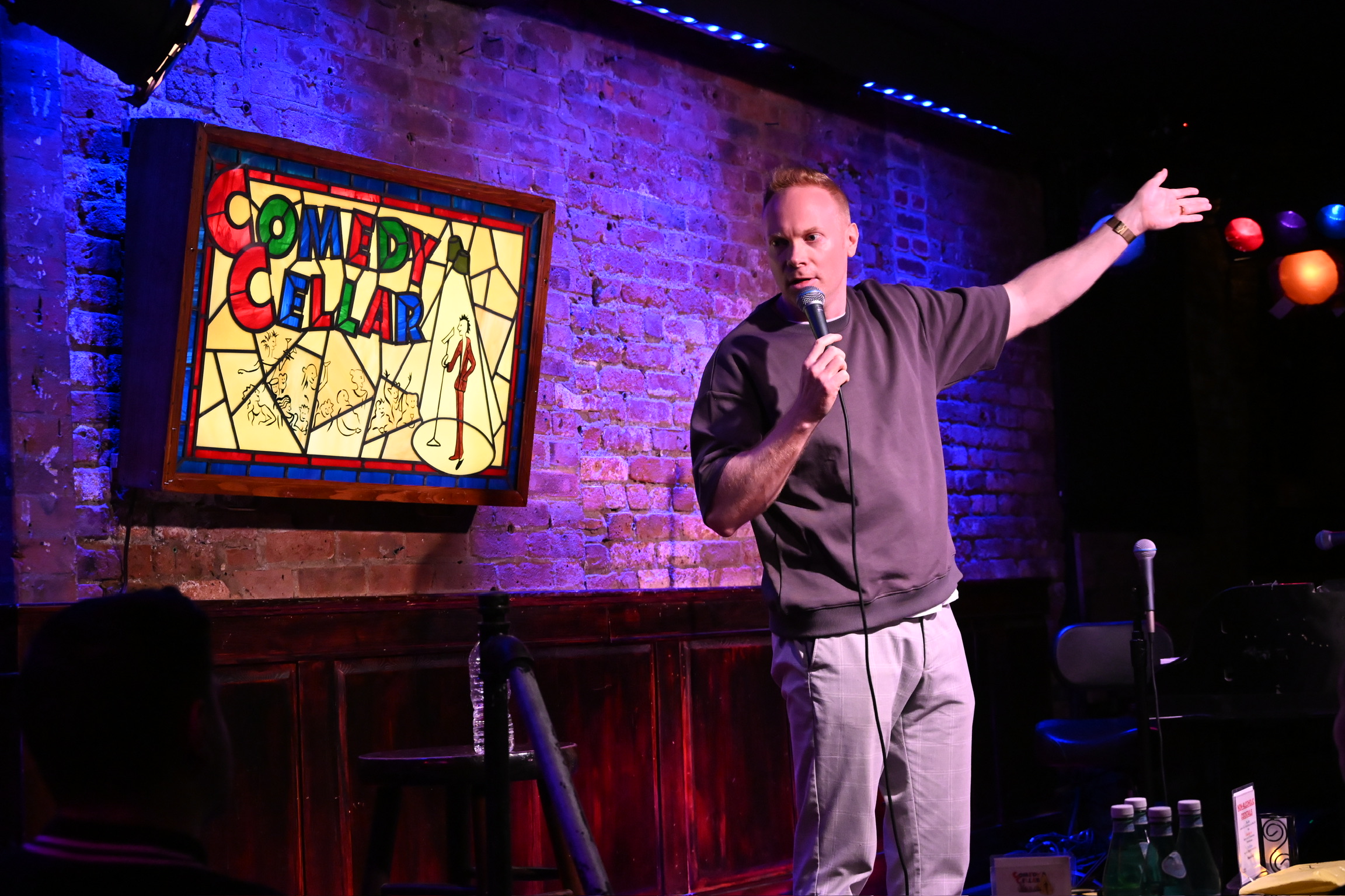 Nathan Macintosh performing on stage at the Comedy Cellar