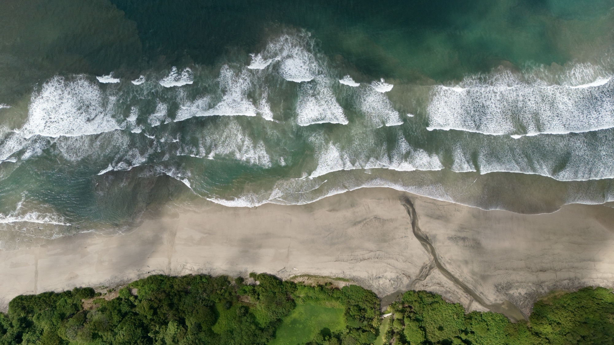Aerial view of the Pacific coast at Playa Guiones, Nosara