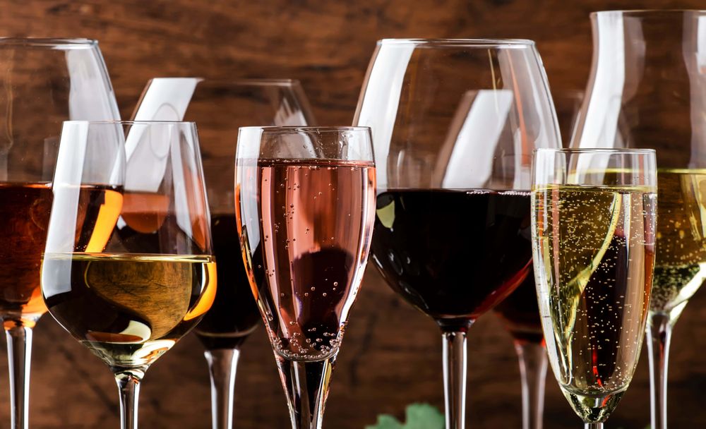 Red and white wine glasses in warm tasting-room light