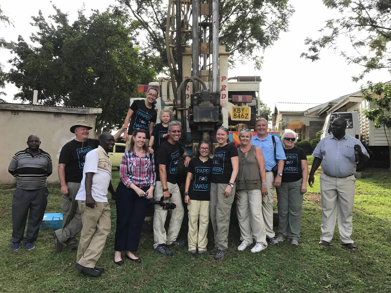 Paper for Water group in front of a drill rig in Africa