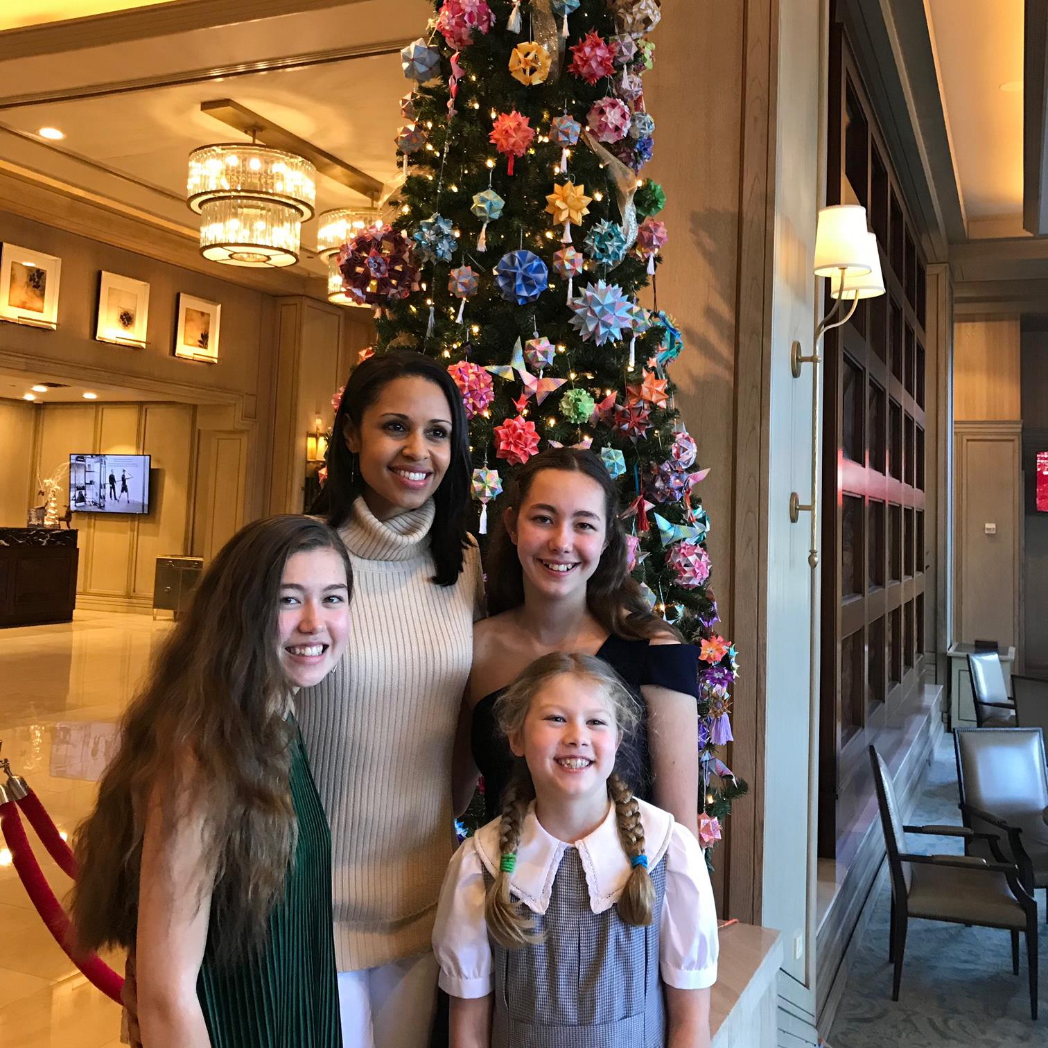 Adams girls with Good Morning America host in front of an origami Christmas tree
