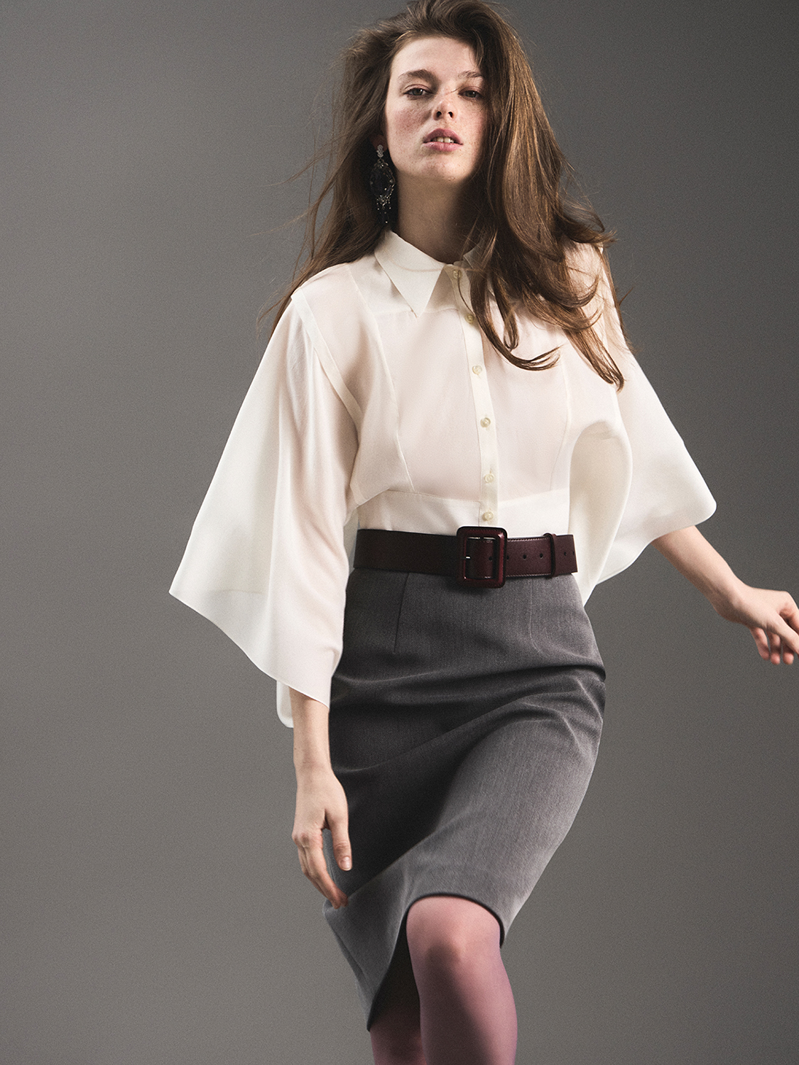 Studio fashion — white oversized button-up, grey midi skirt with burgundy belt