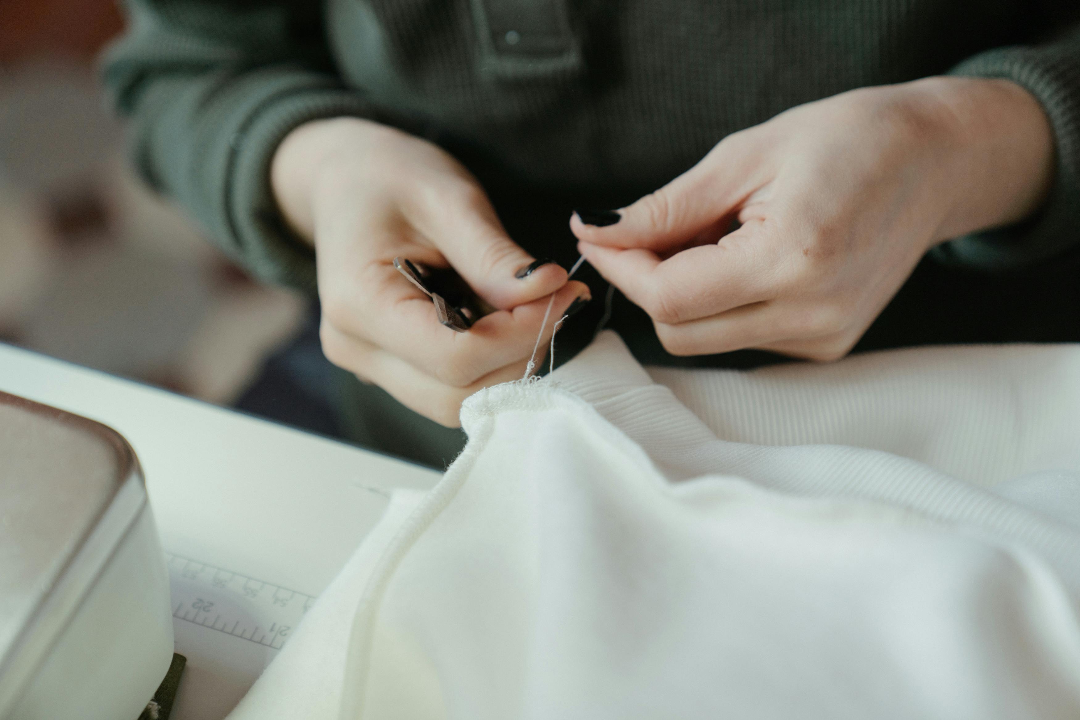 Skilled tailor working on detailed alterations at Panmure Tailoring