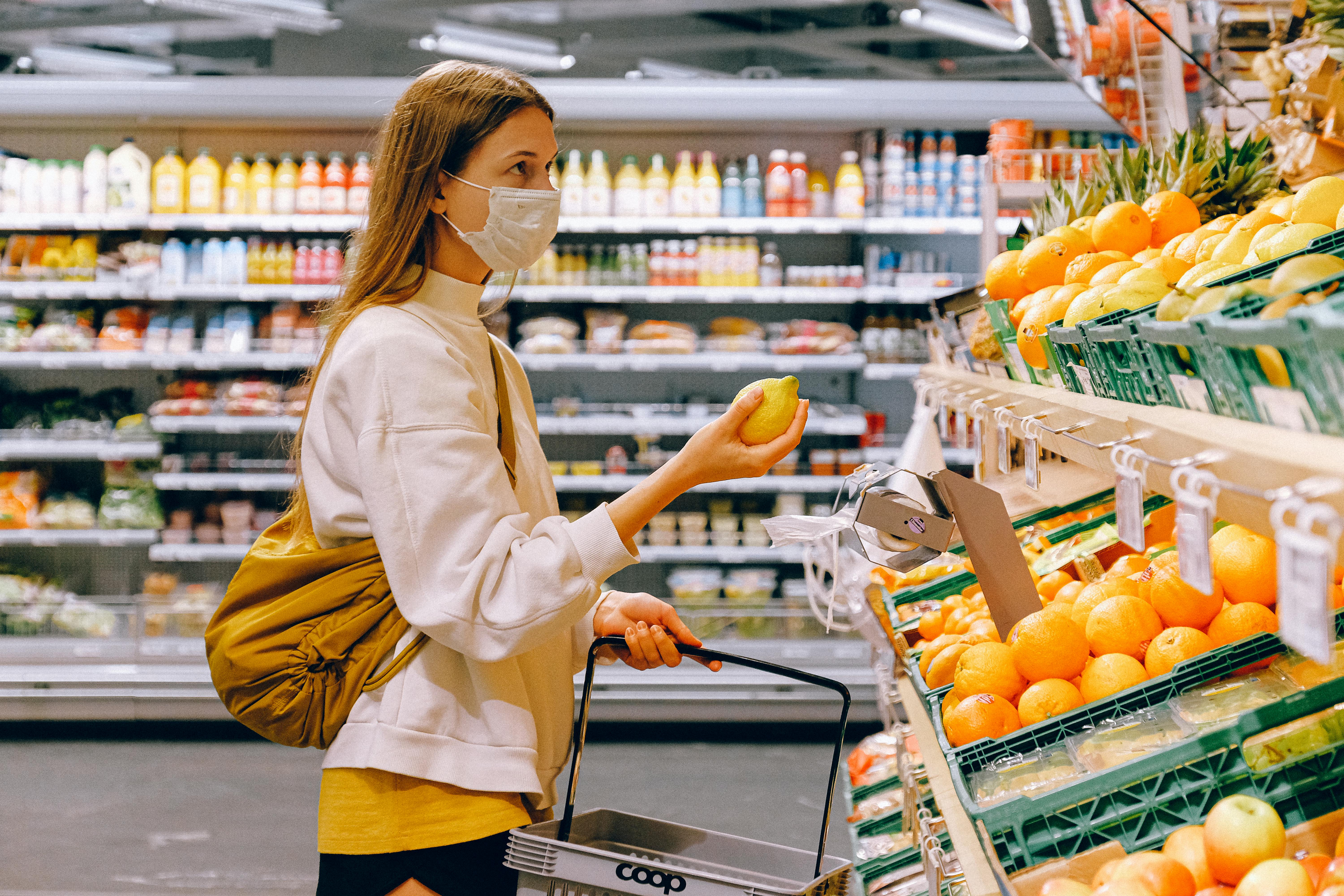 Customer shopping for fresh produce in grocery section
