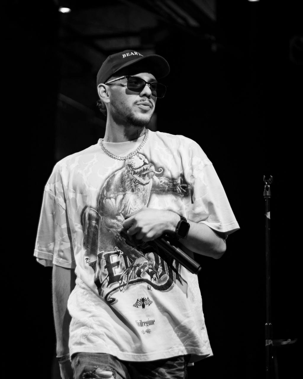 Estuardo black and white portrait with microphone