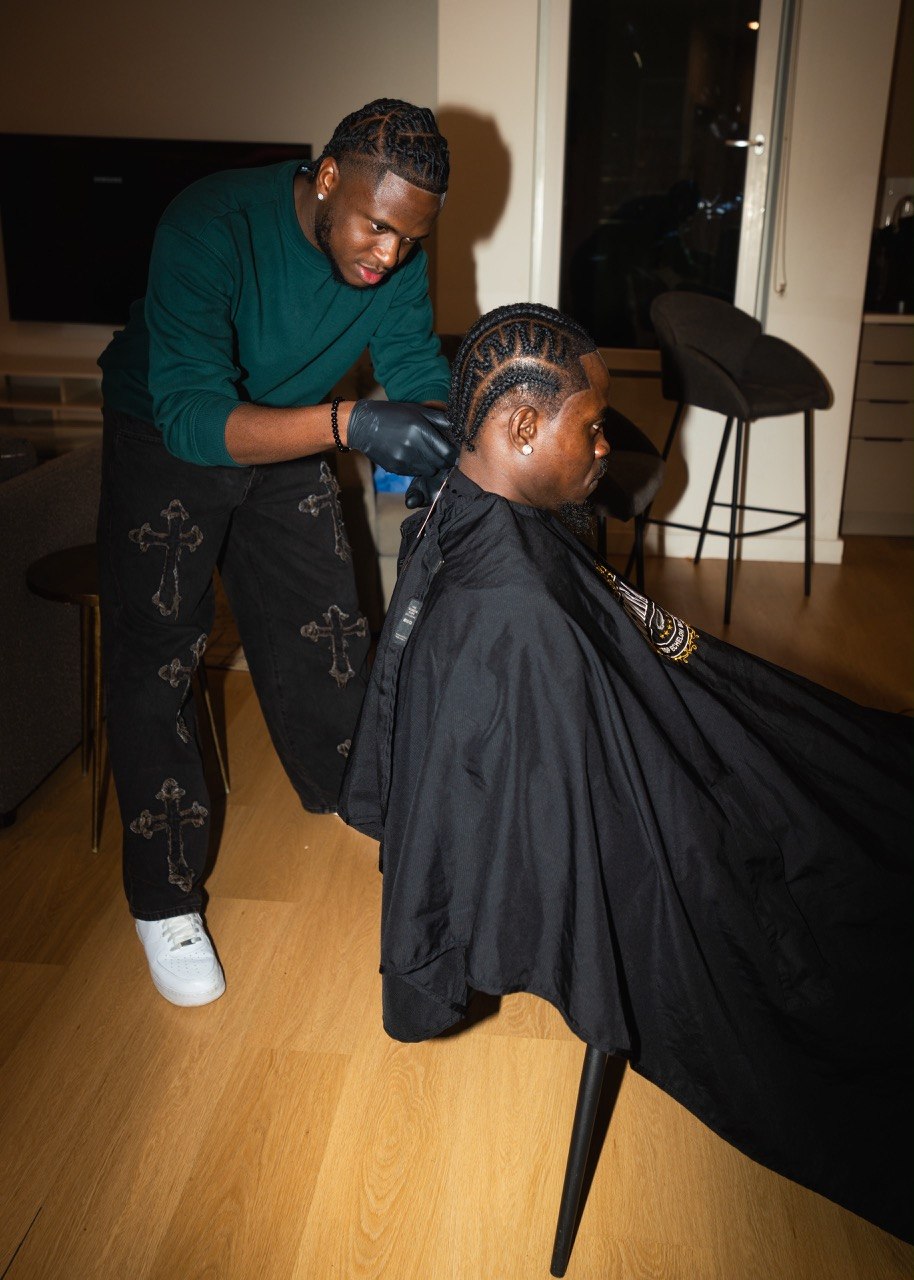Detailed braid work during a private luxury apartment session