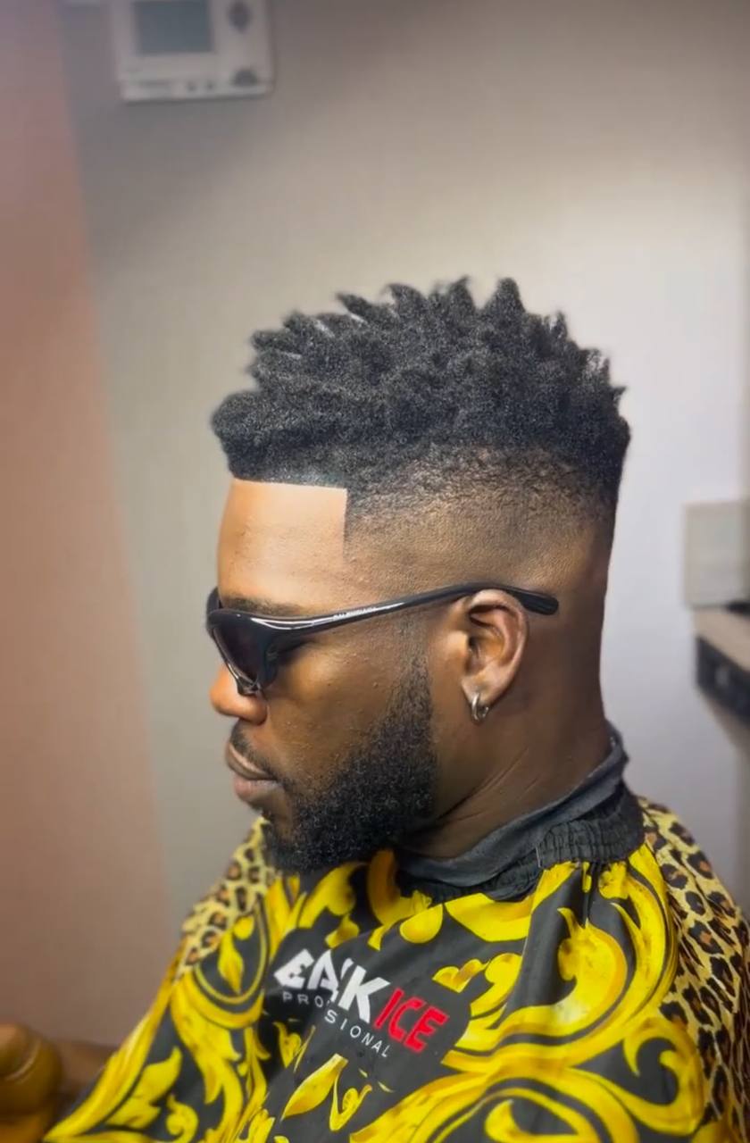 High-fade mohawk design with clean lines