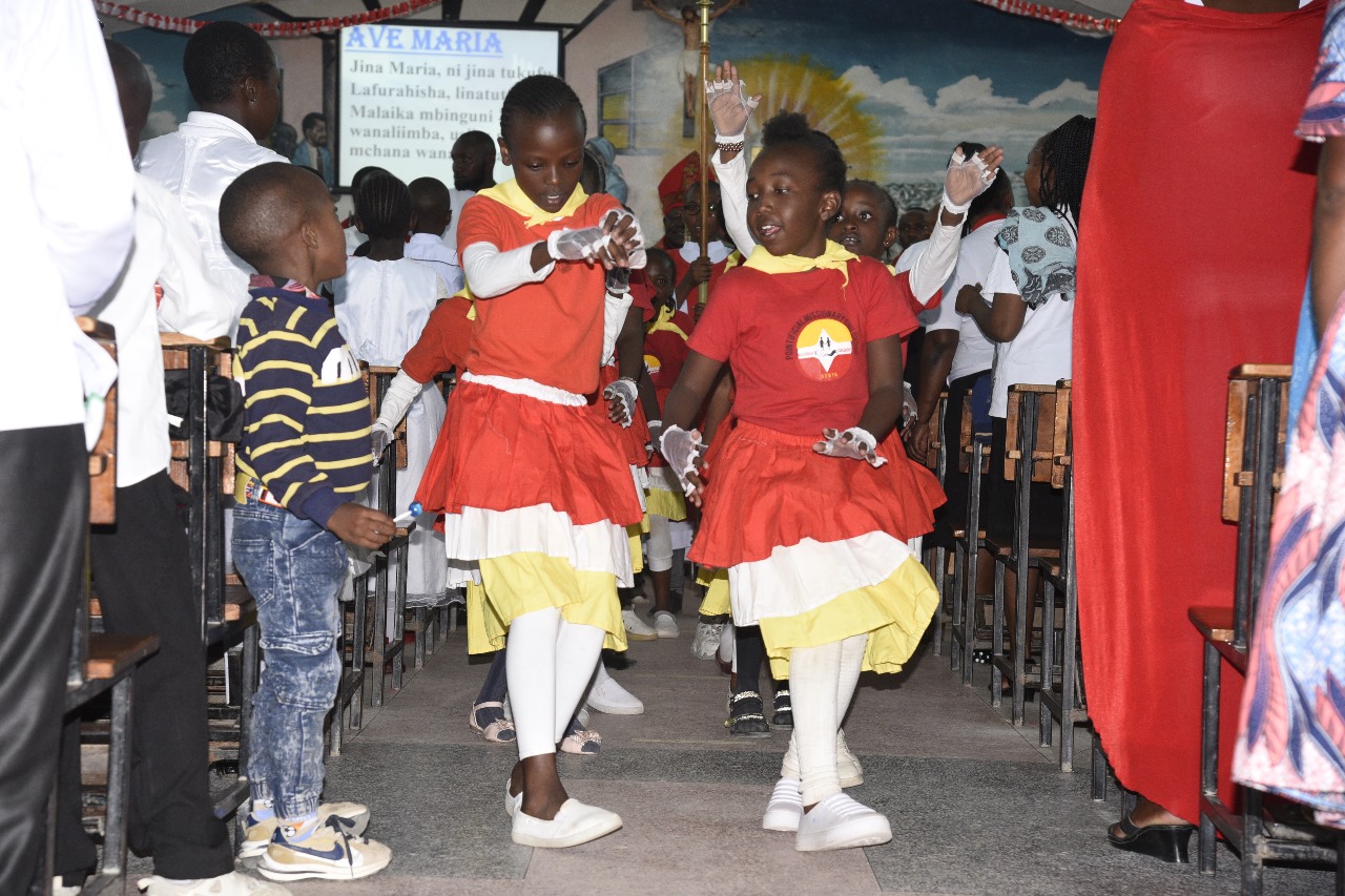 PMC children performing liturgical dance during Mass