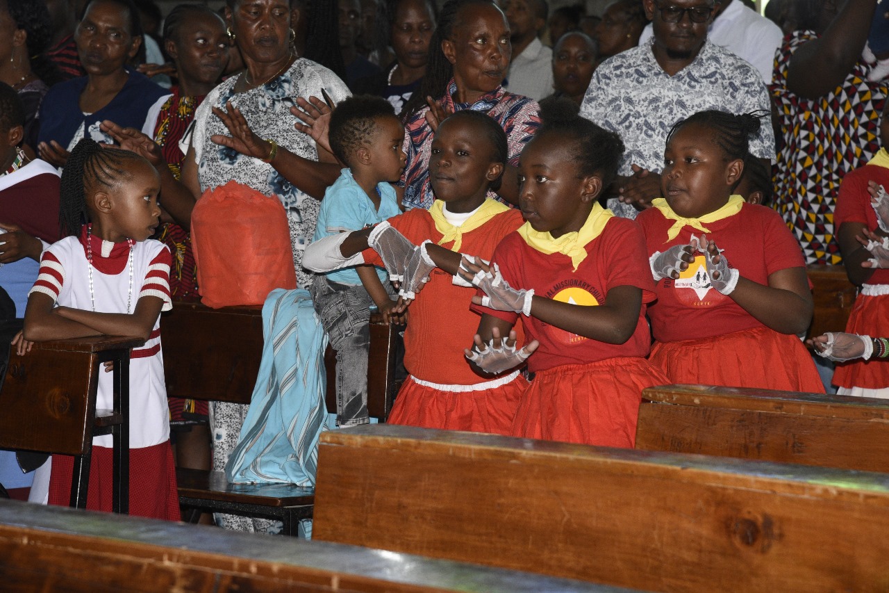 PMC children participating in Mass service