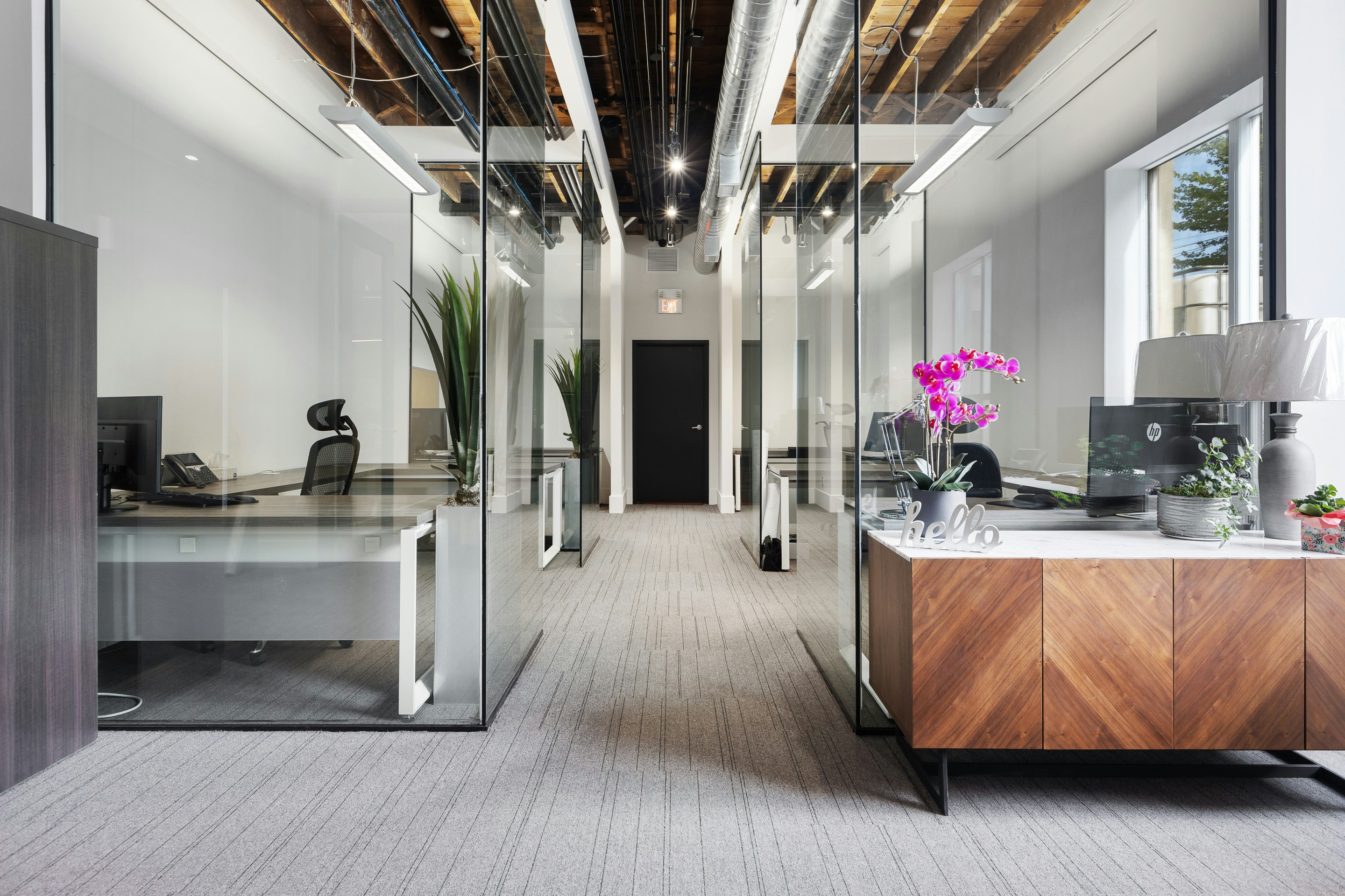Modern commercial office space with glass partitions and professional design