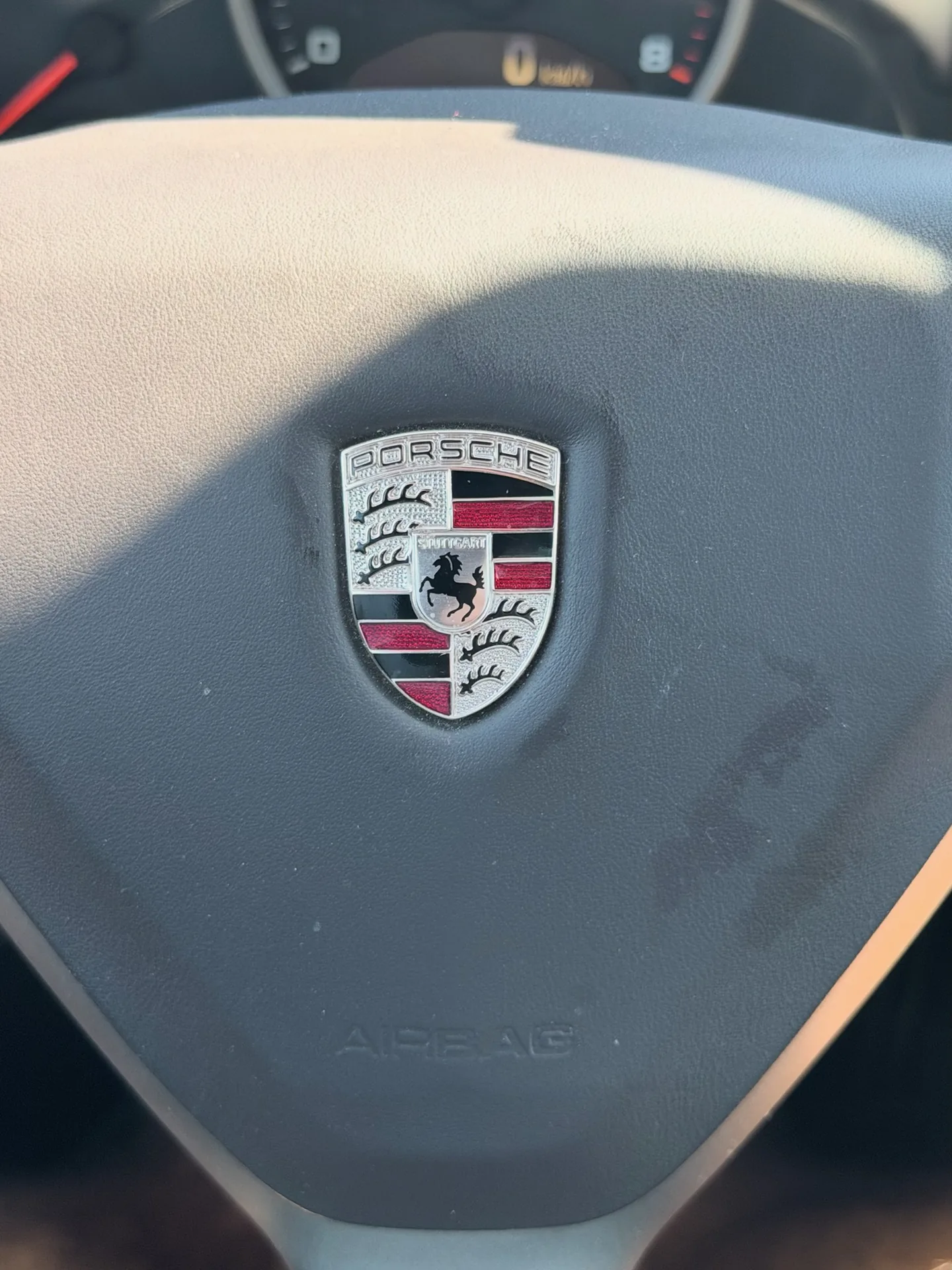 Porsche crest on the steering wheel