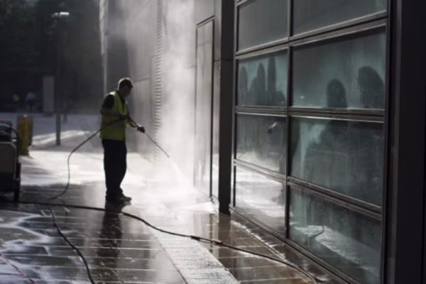 Pressure-washing work on an exterior commercial hardscape surface