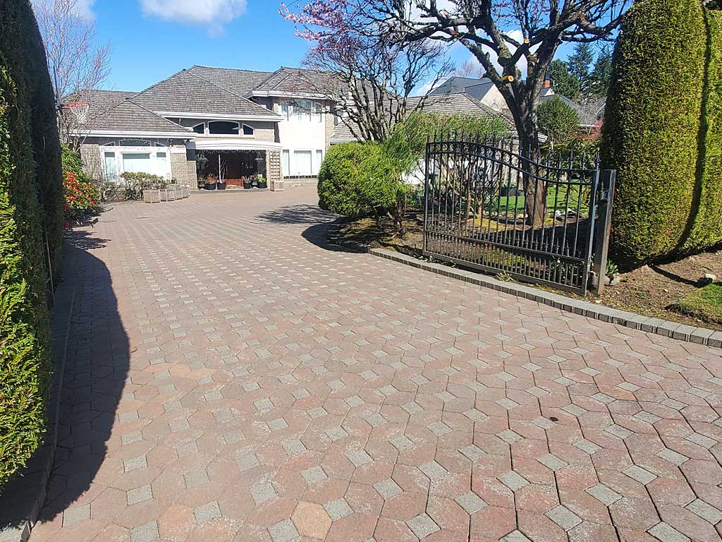 Clean finished paver driveway after pressure washing