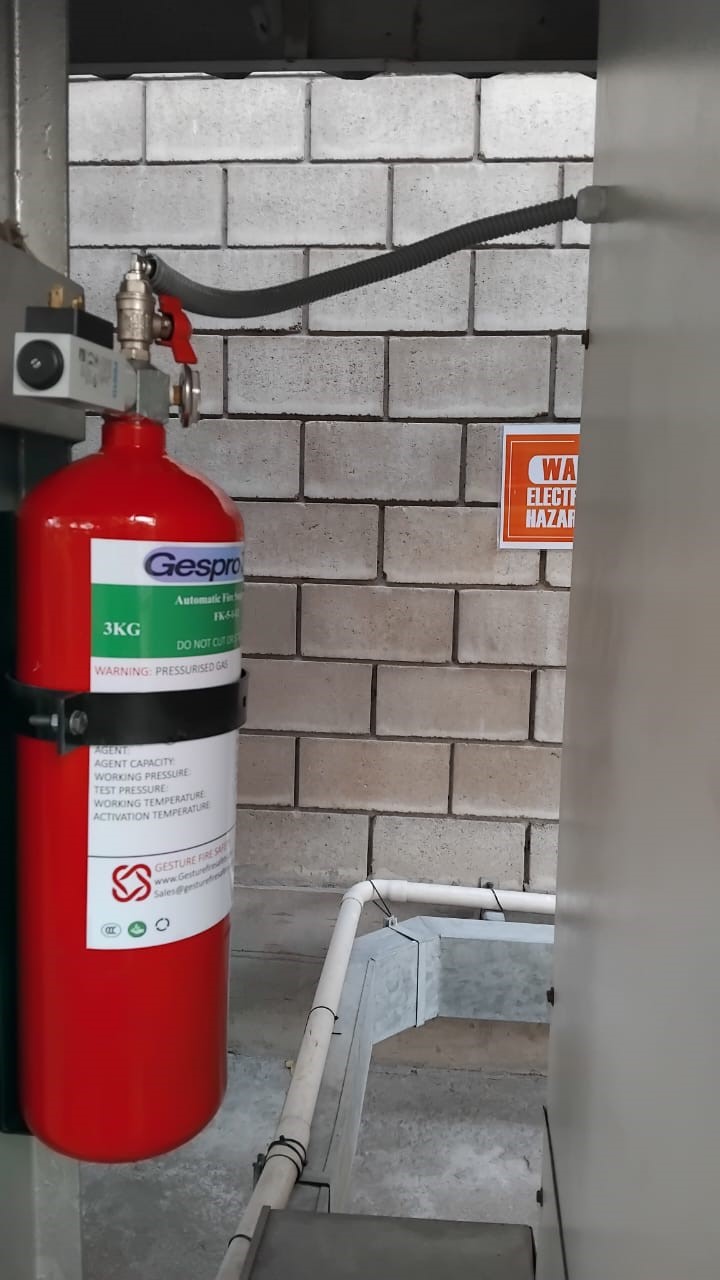 Fire suppression cylinder in enclosure