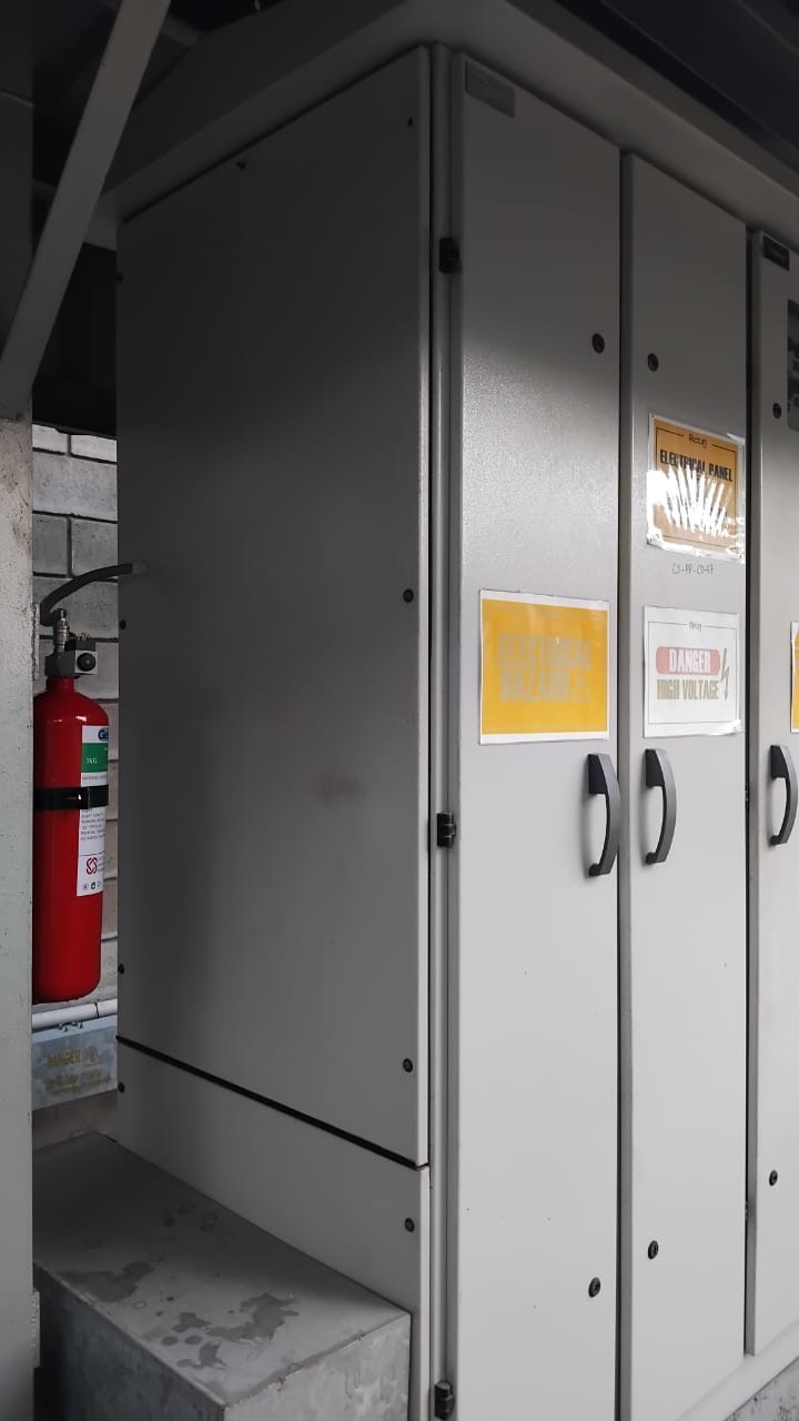 Electrical cabinet with fire extinguisher