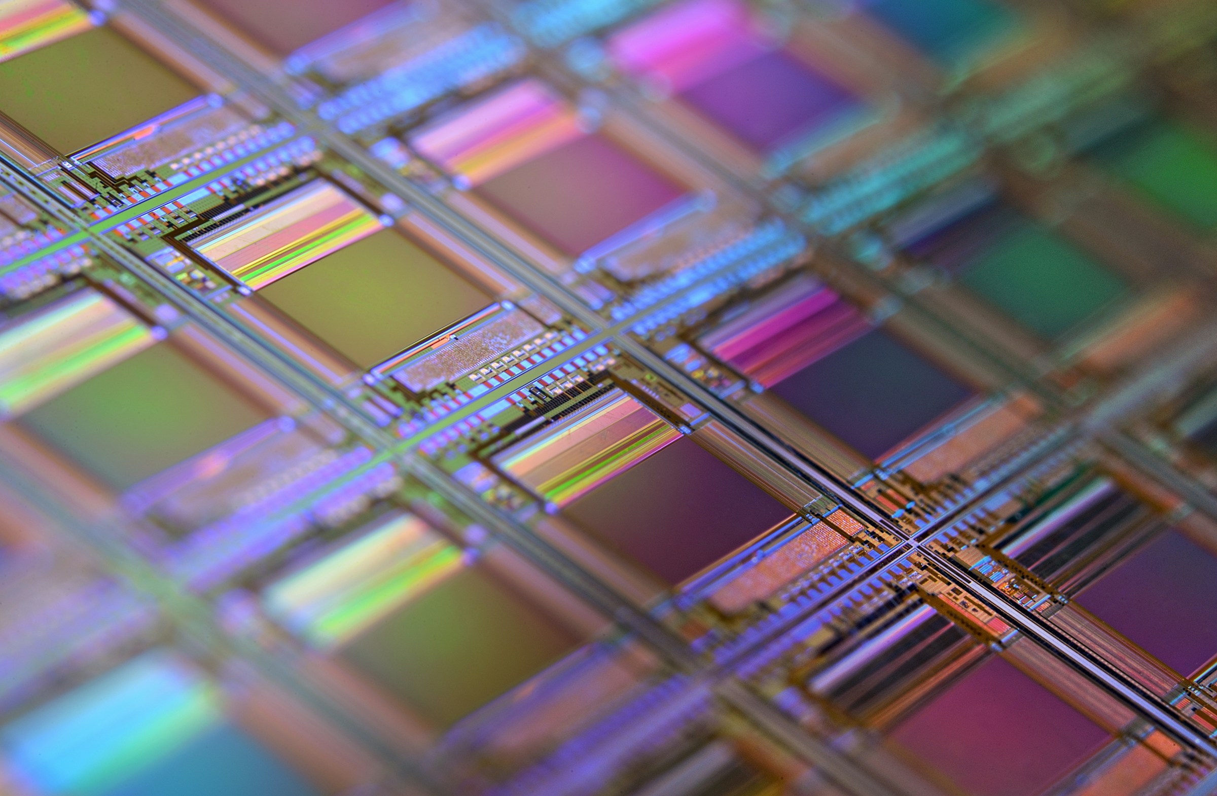 Iridescent semiconductor wafer macro with rainbow colors