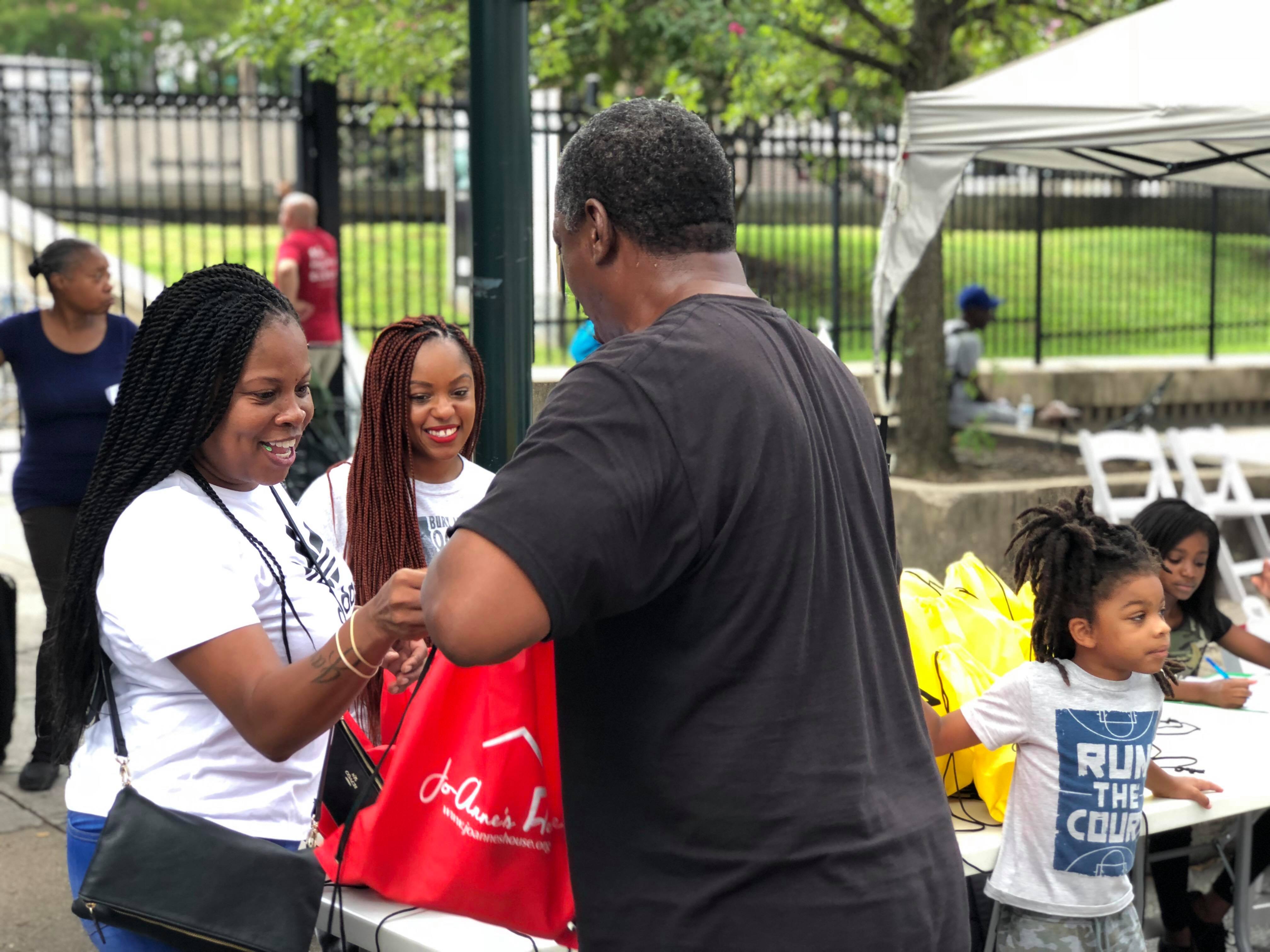 Volunteers distributing supplies to community