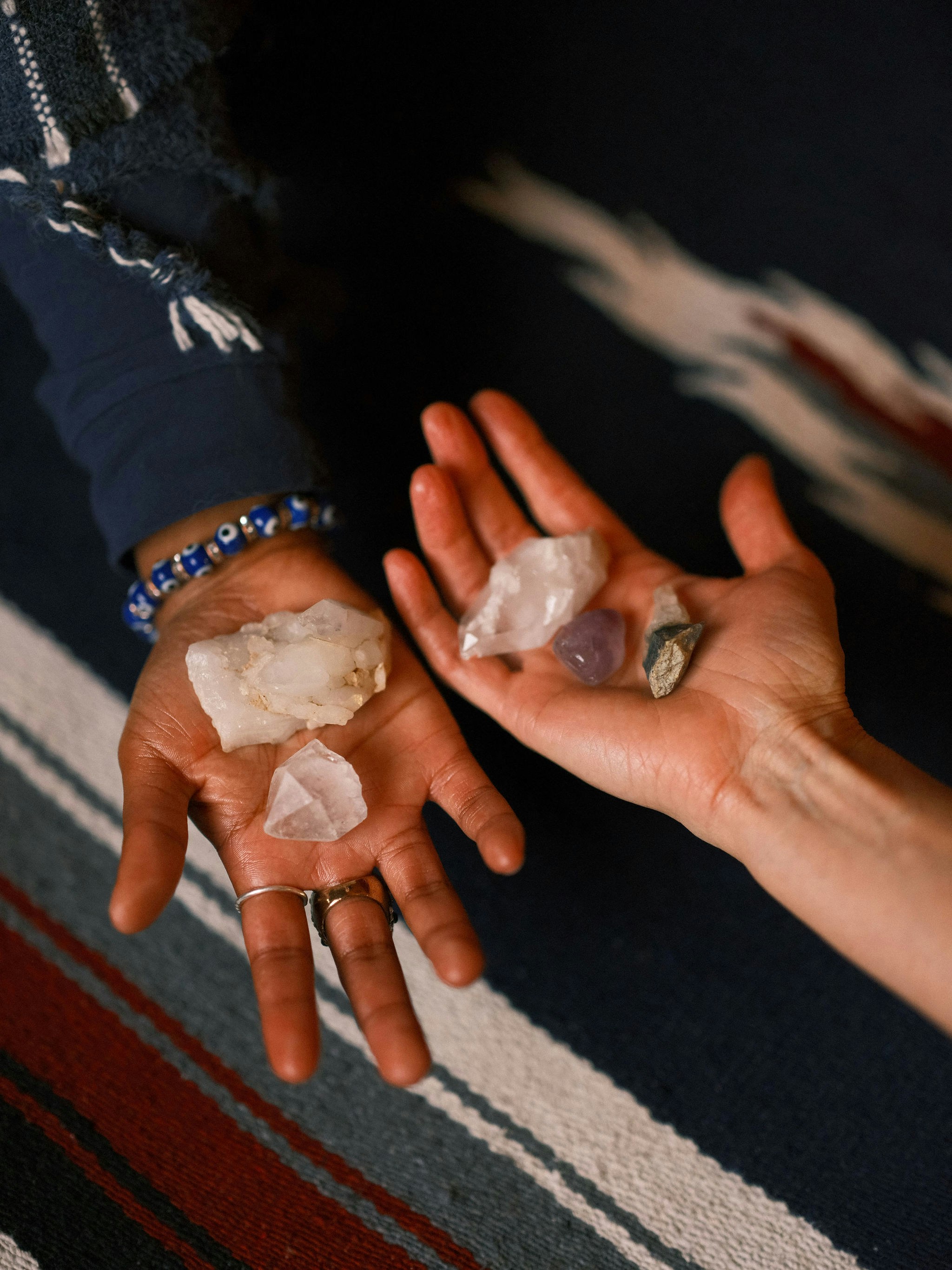 Hands holding crystals