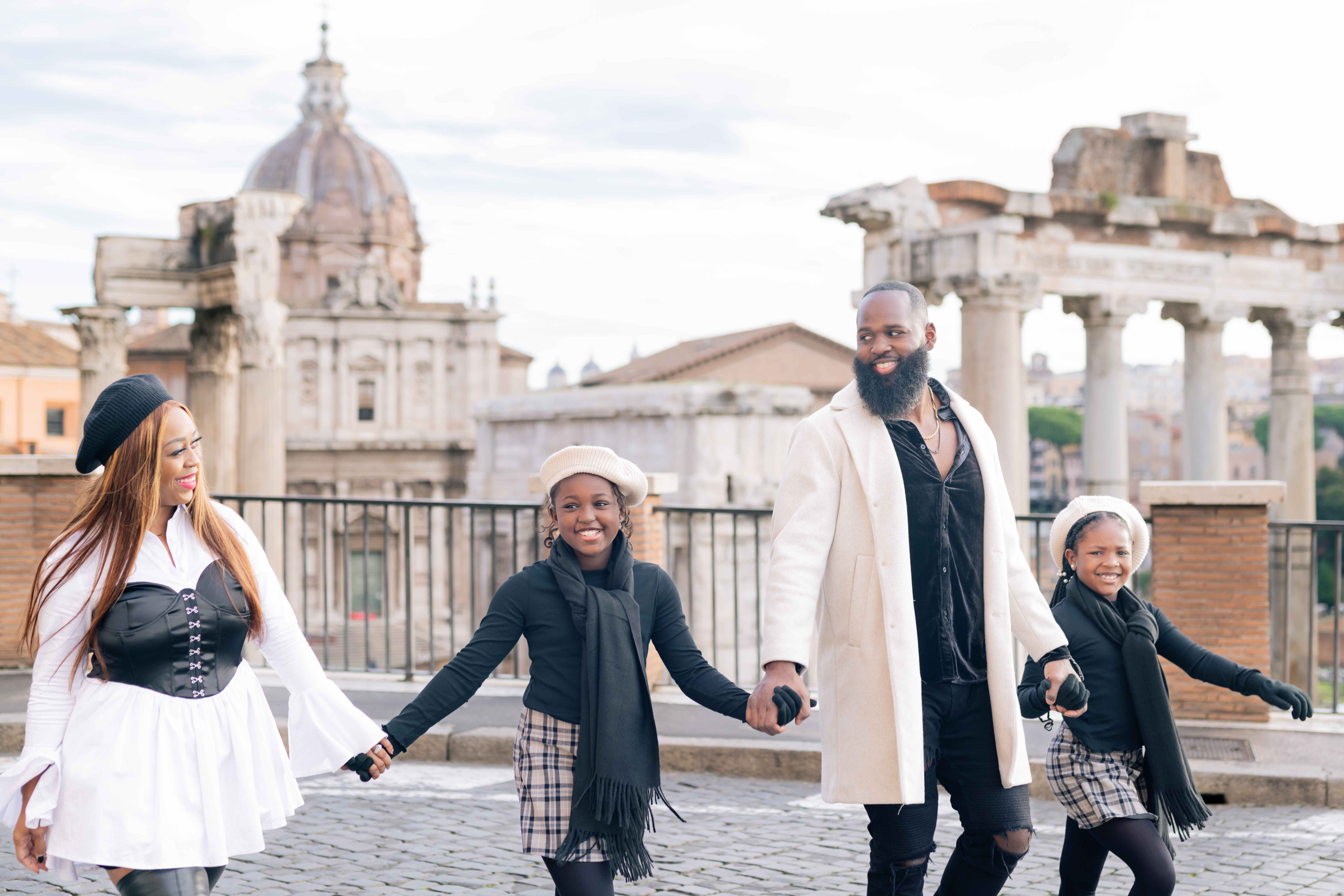 Andre Fluellen with his wife and two daughters walking together in Rome