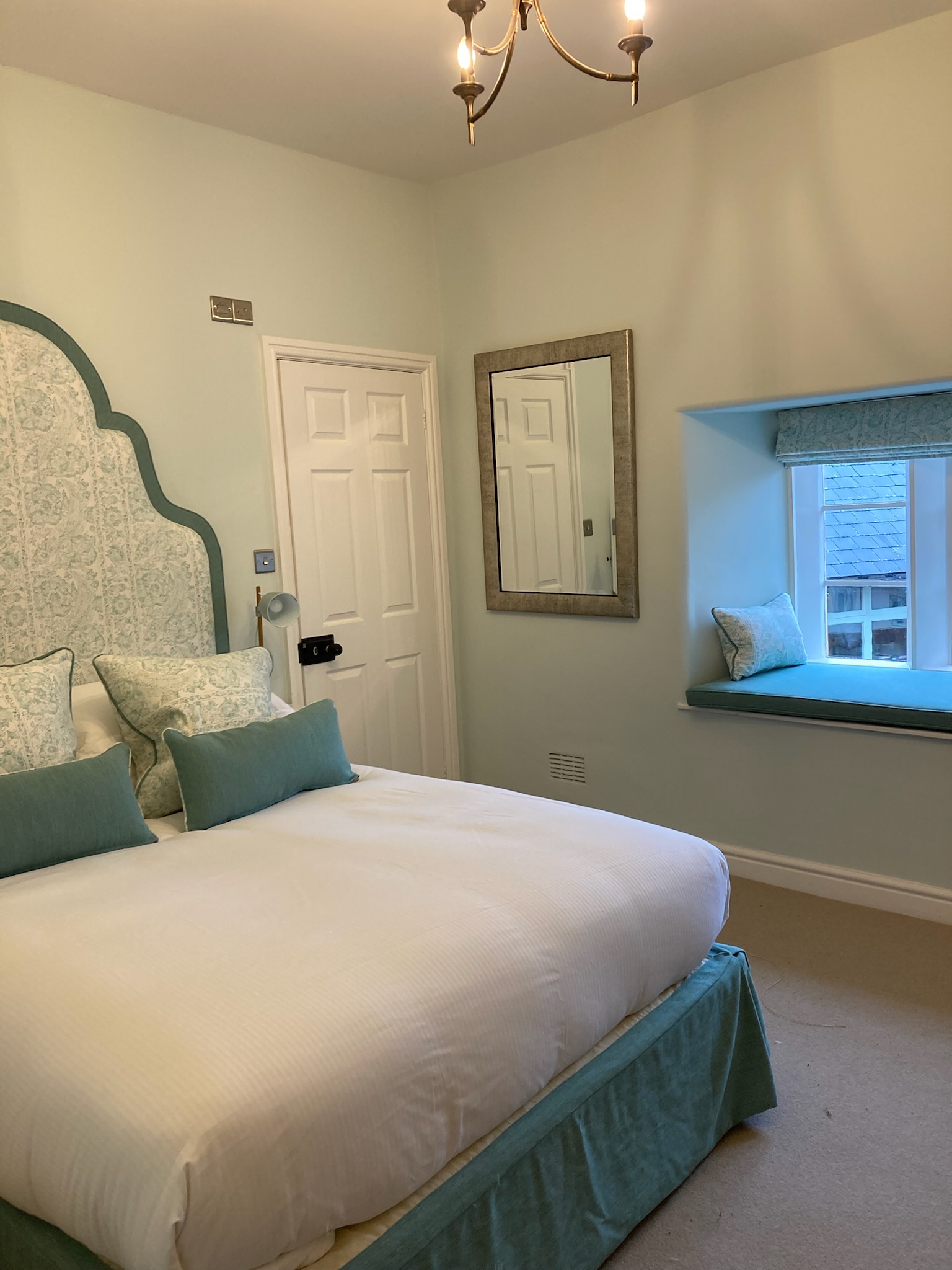 Hotel bedroom with duck egg blue colour scheme