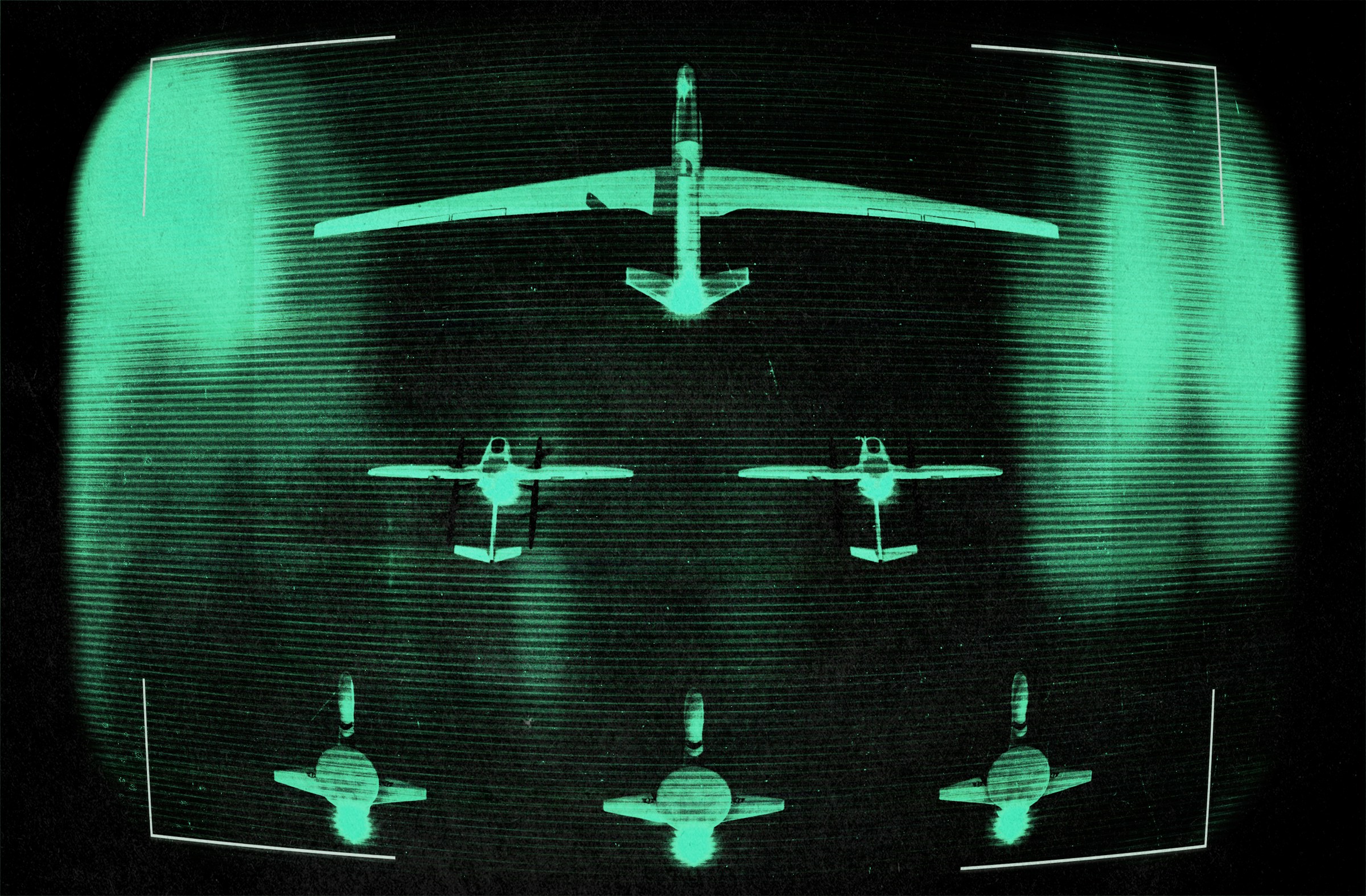 Night vision view of military aircraft formation in green monochrome
