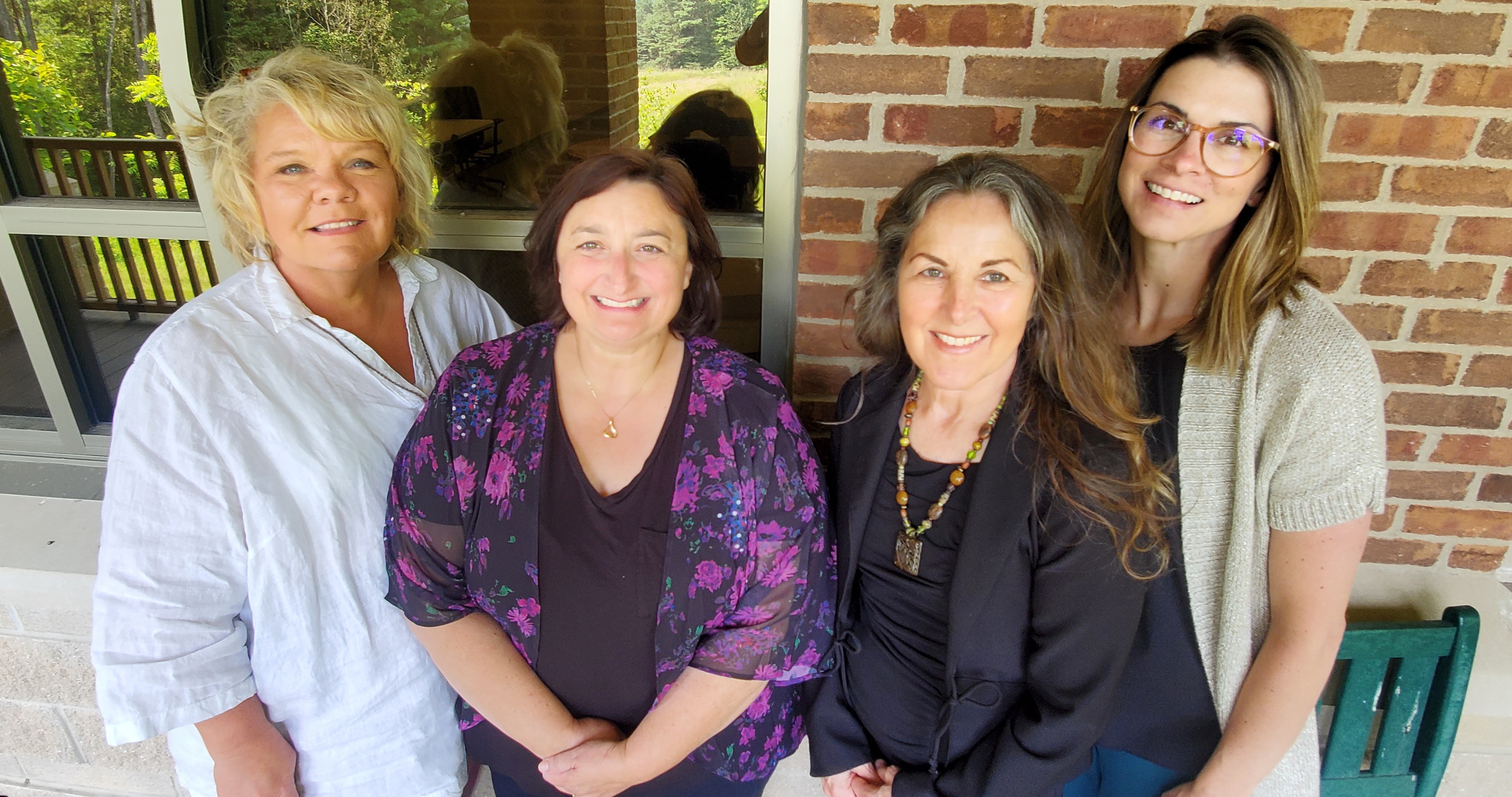 ShareCare team members - four smiling women volunteers