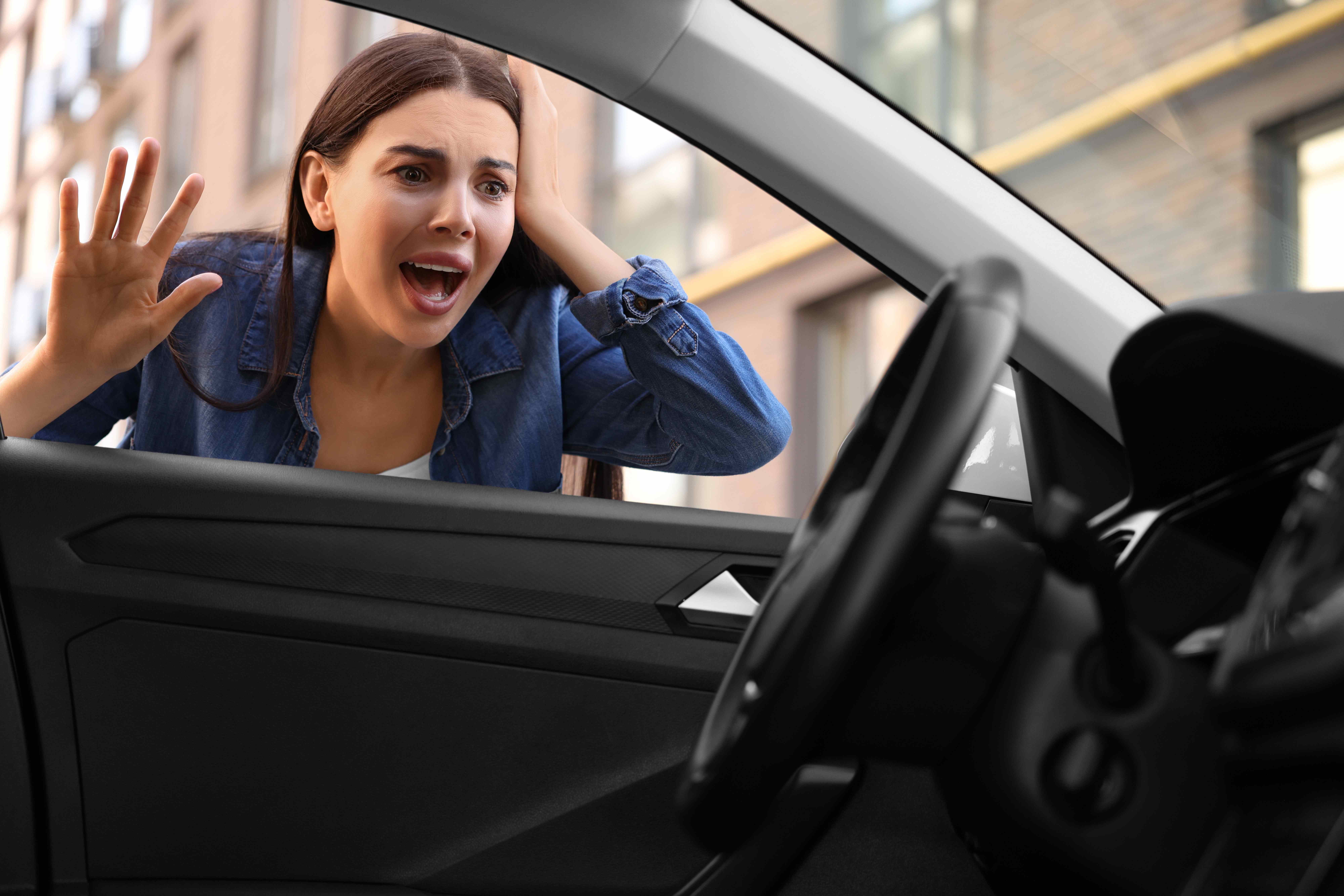 Driver locked out of a car and calling for help