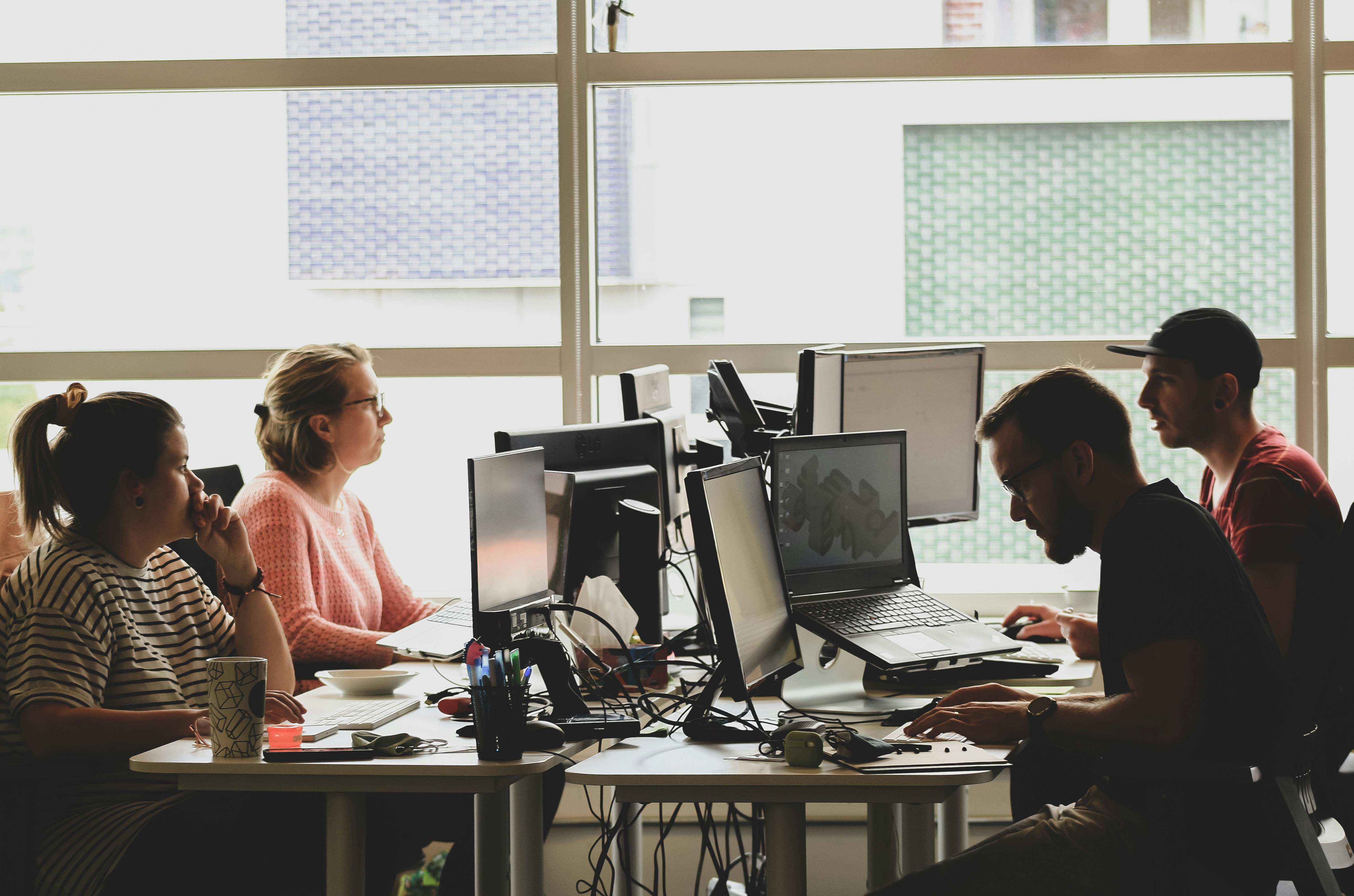 Team of developers working together in a modern office space