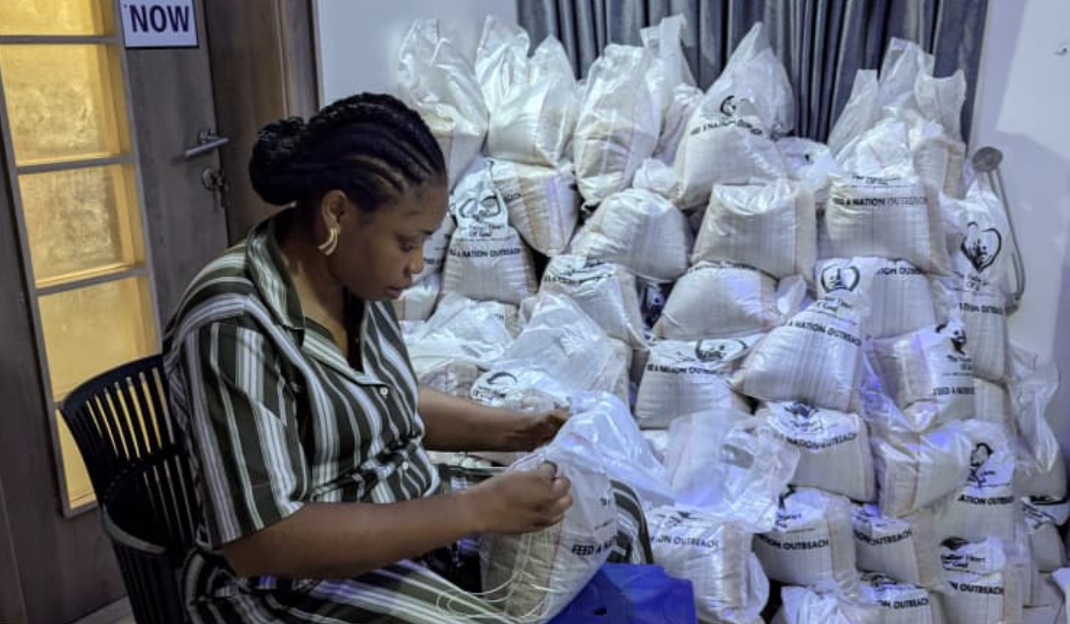 Woman packing supplies into bags for distribution
