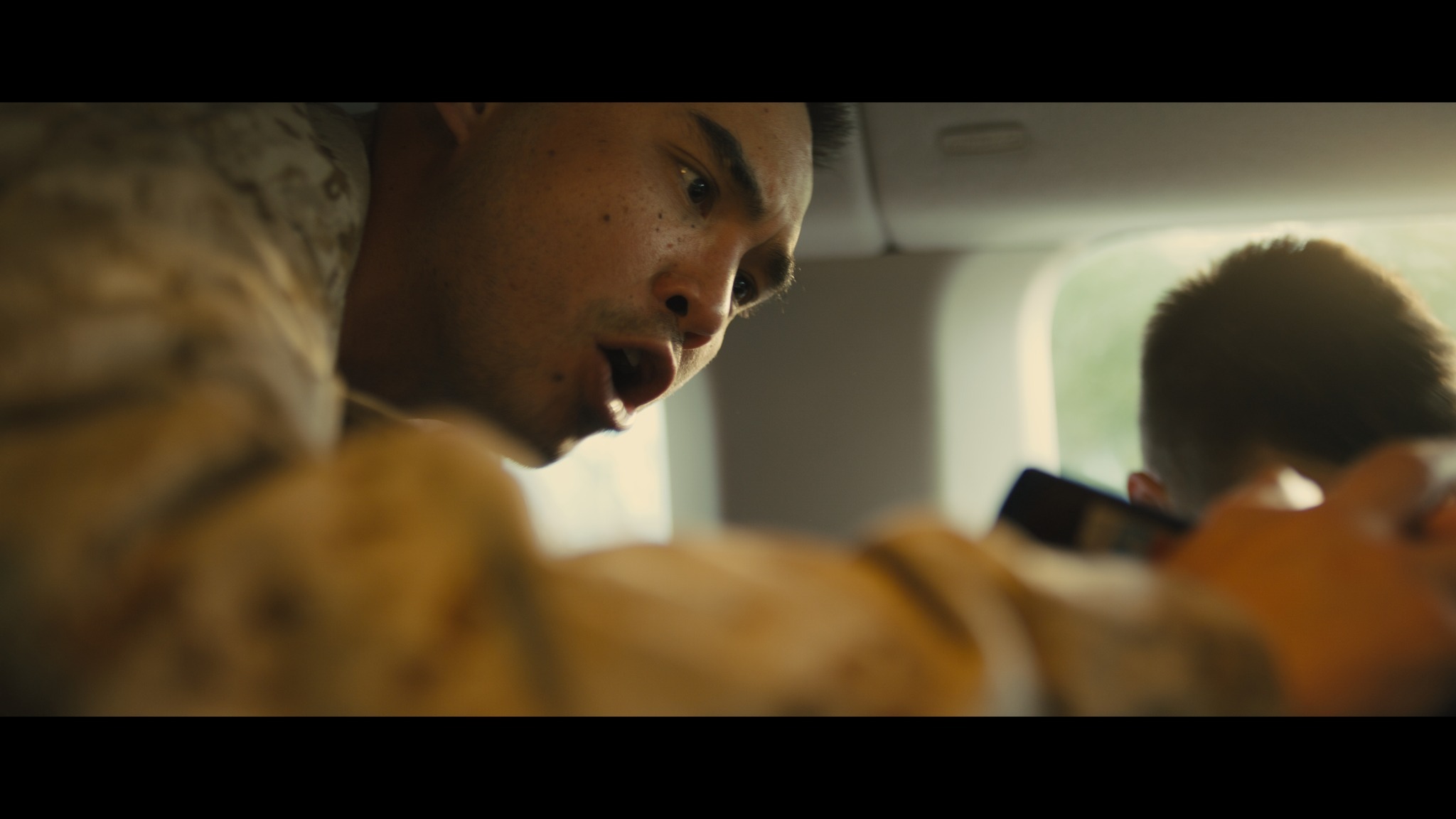Soldier emotional close-up in vehicle