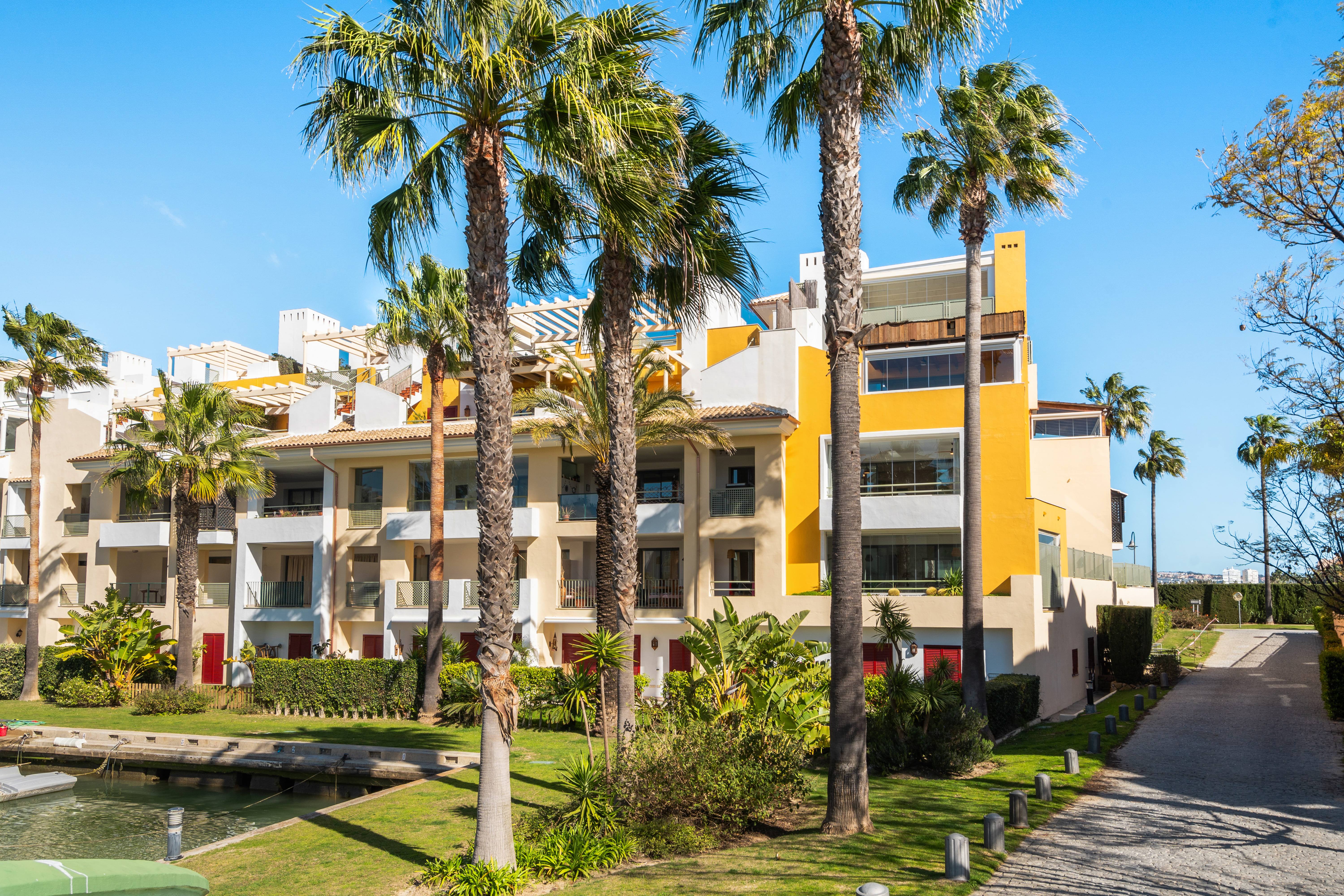 Sotogrande Alboaire - Exterior complex with distinctive yellow architecture