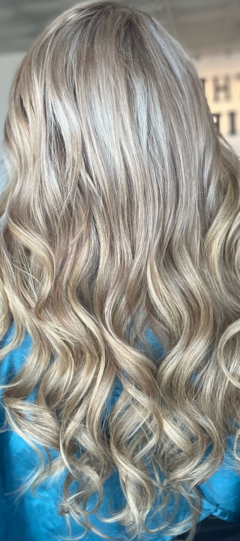 Back view of silver-ash blonde wavy hair